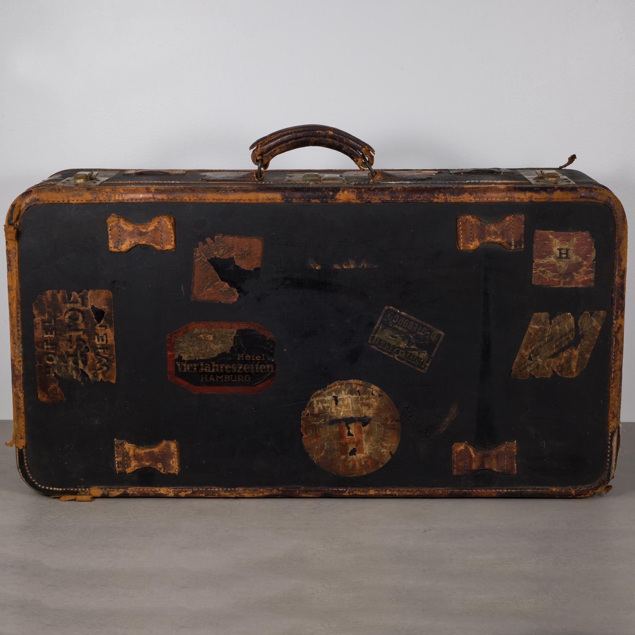 About:

This is an original antique luggage. The luggage is covered with travel stickers that include 