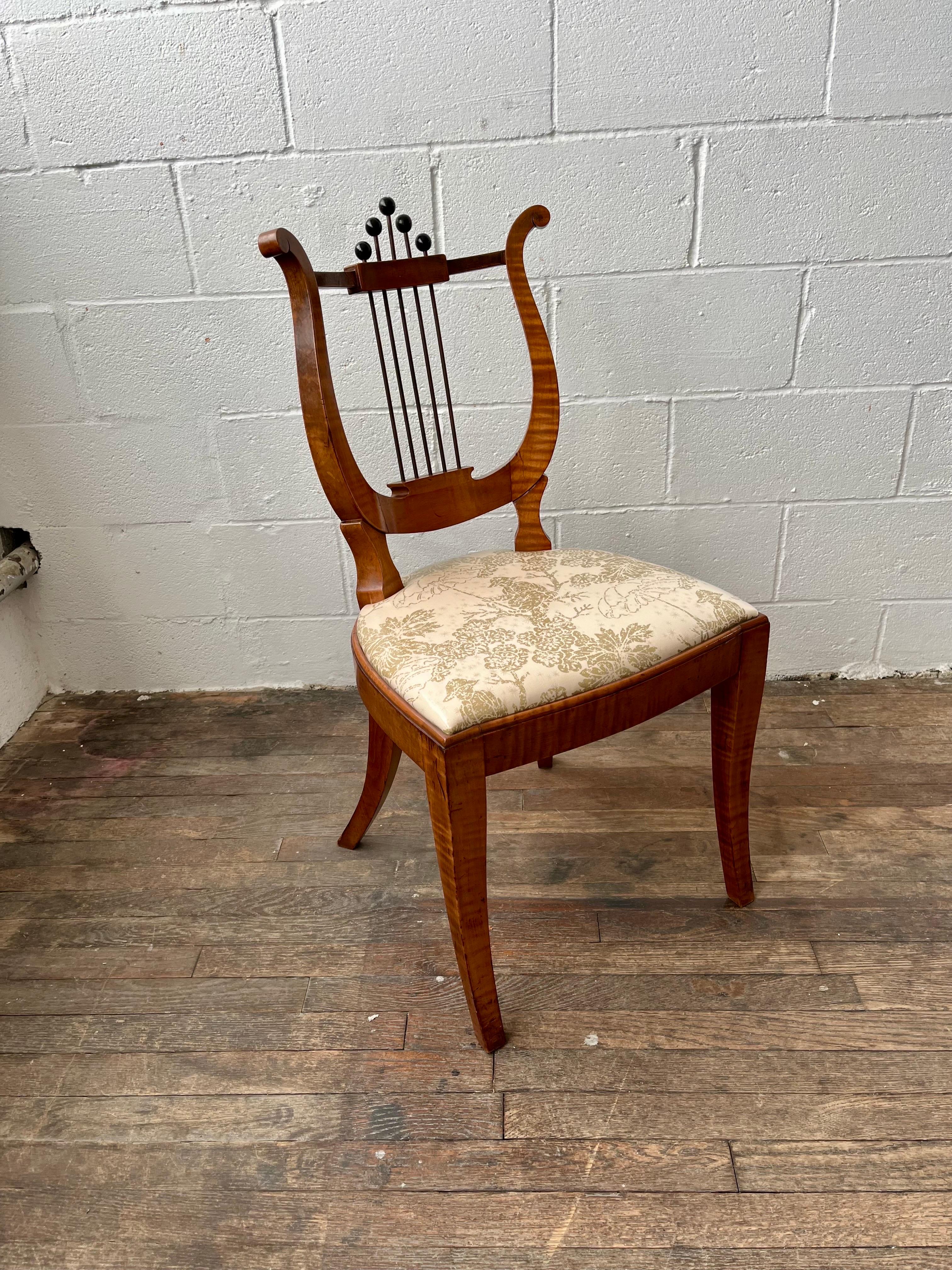 Wonderful Lyre Back chair. Beautiful grained wood and lines. Metal spindles with ball finials. New laminate over silk blend upholstery with a Chinoiserie Chic vibe. 
Curbside to NYC/Philly $300