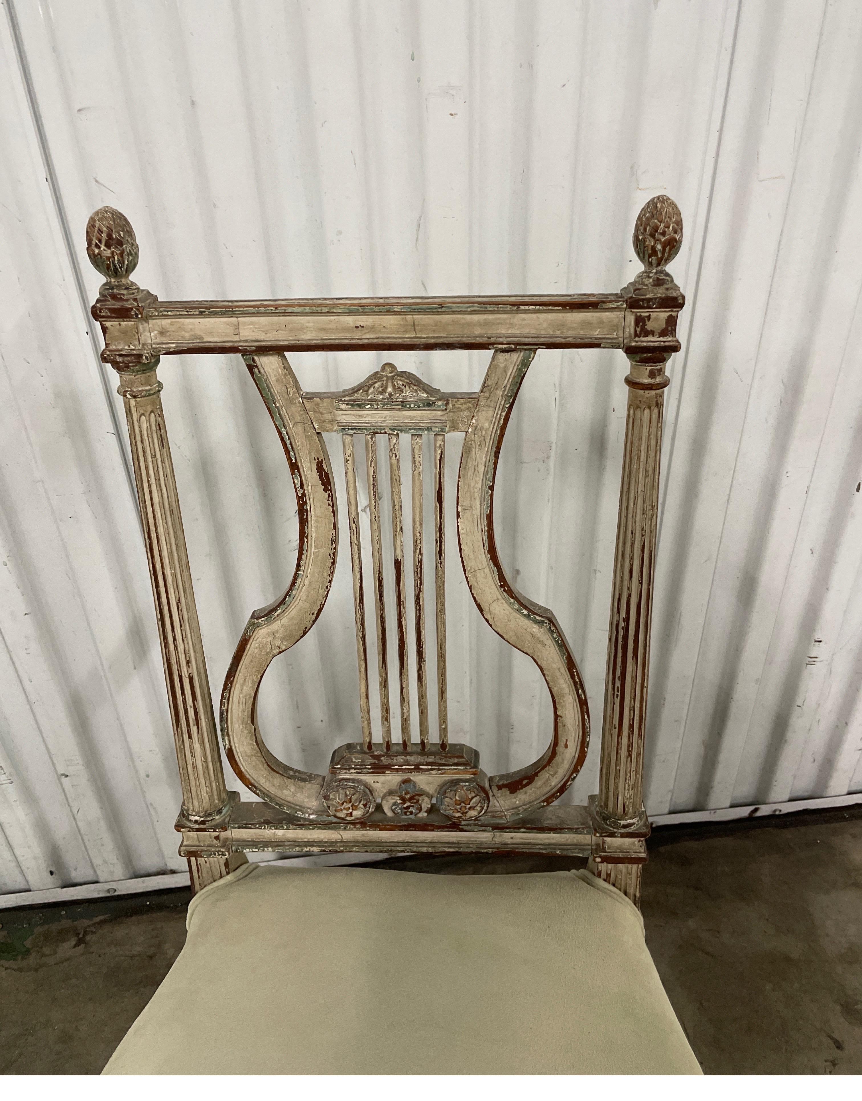 Charming antique French lyre back slipper chair.  It has a painted frame and newly upholstered suede seat. Very good condition with original painted frame.
