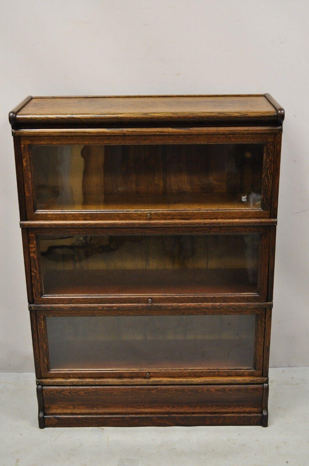Antique macey 3 section mission oak stacking barrister lawyers bookcase. Item features (1) Top, (3) stacking bookcase sections, (1) base, beautiful wood grain, 5 part construction, original stamps, very nice antique item, great style and form. circa