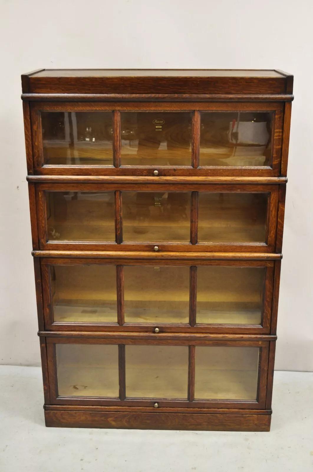 Antique Macey Mission Oak Arts & Crafts 4 Section Stacking Barrister Bookcase. Item features individual panes of glass, beautiful wood grain, original labels, quality American craftsmanship. (2) Sections are model 