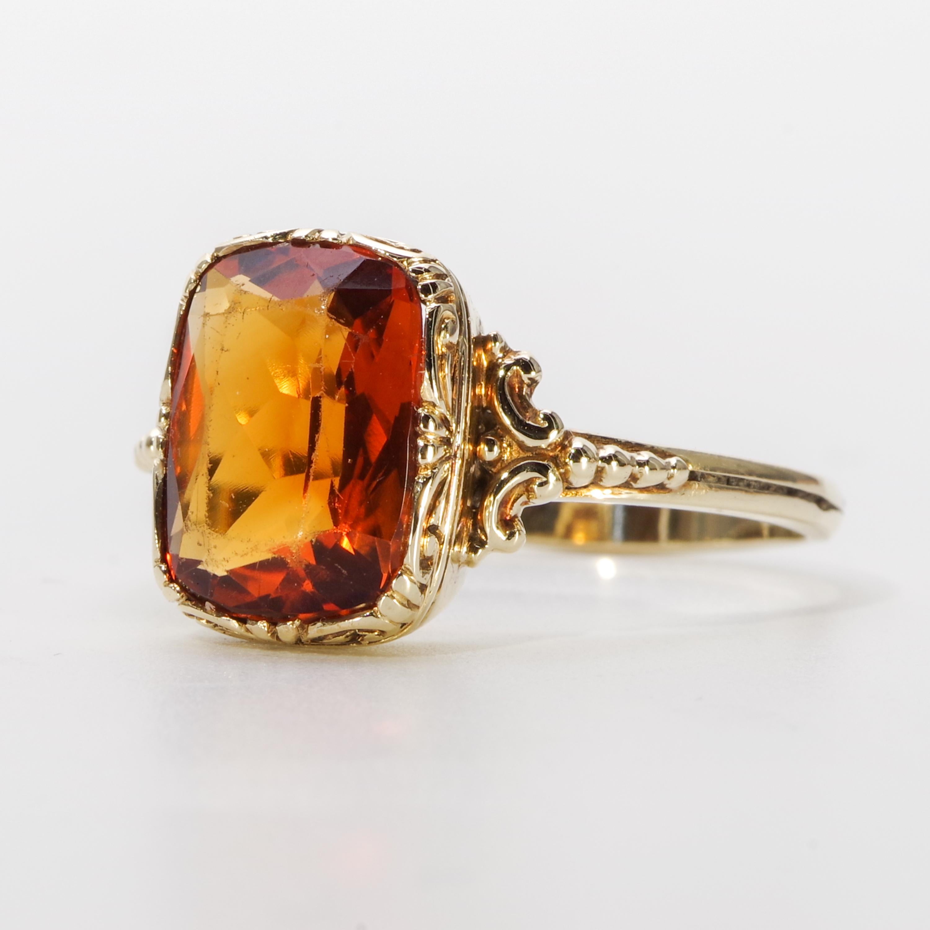Men used to wear rings like this. Men used to be cool. 

This regal 14k green-ish gold ring features a Madeira citrine of approximately 5 carats. Citrine is kind of an ordinary gemstone but *Madeira* citrine is the opposite of ordinary. It's named