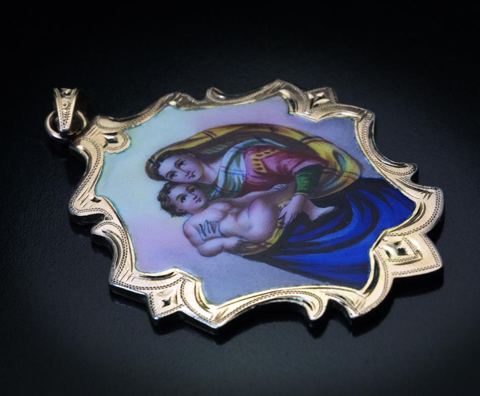 Central European, circa 1880s-1890s.

This large antique 14K gold pendant with a hand-engraved border features enameled Madonna and Child after Raphael’s The Sistine Madonna painting.

The back of the pendant is enameled with inscription in