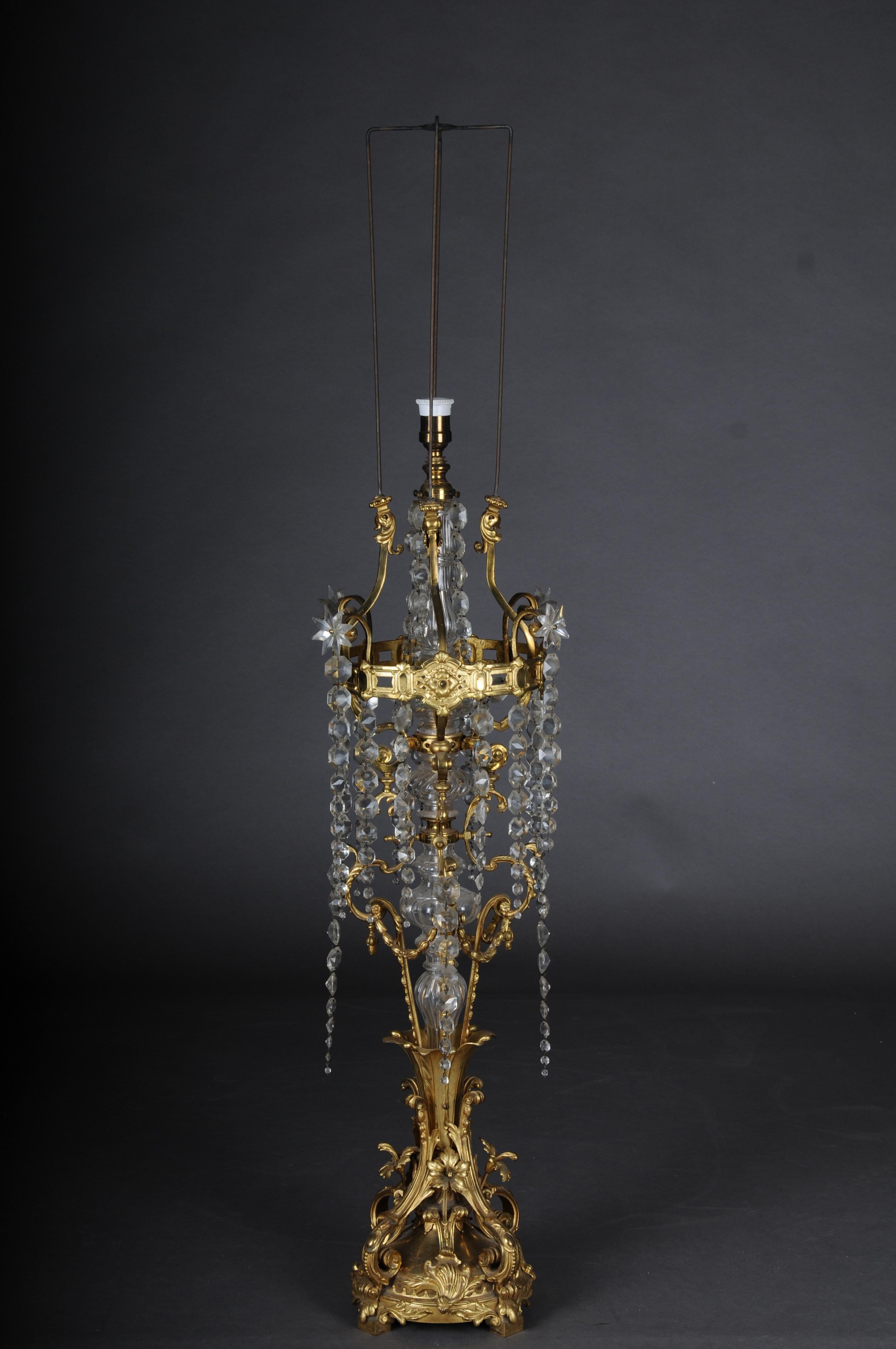 Antique magnificent floor lamp, bronze, gold Napoleon III.

Voluminous body with curved bronze arms. Lavishly with crystal curtains.
Solid gilt bronze base with curved volutes in Louis XV style.

Finely cast and chased bronze elements,