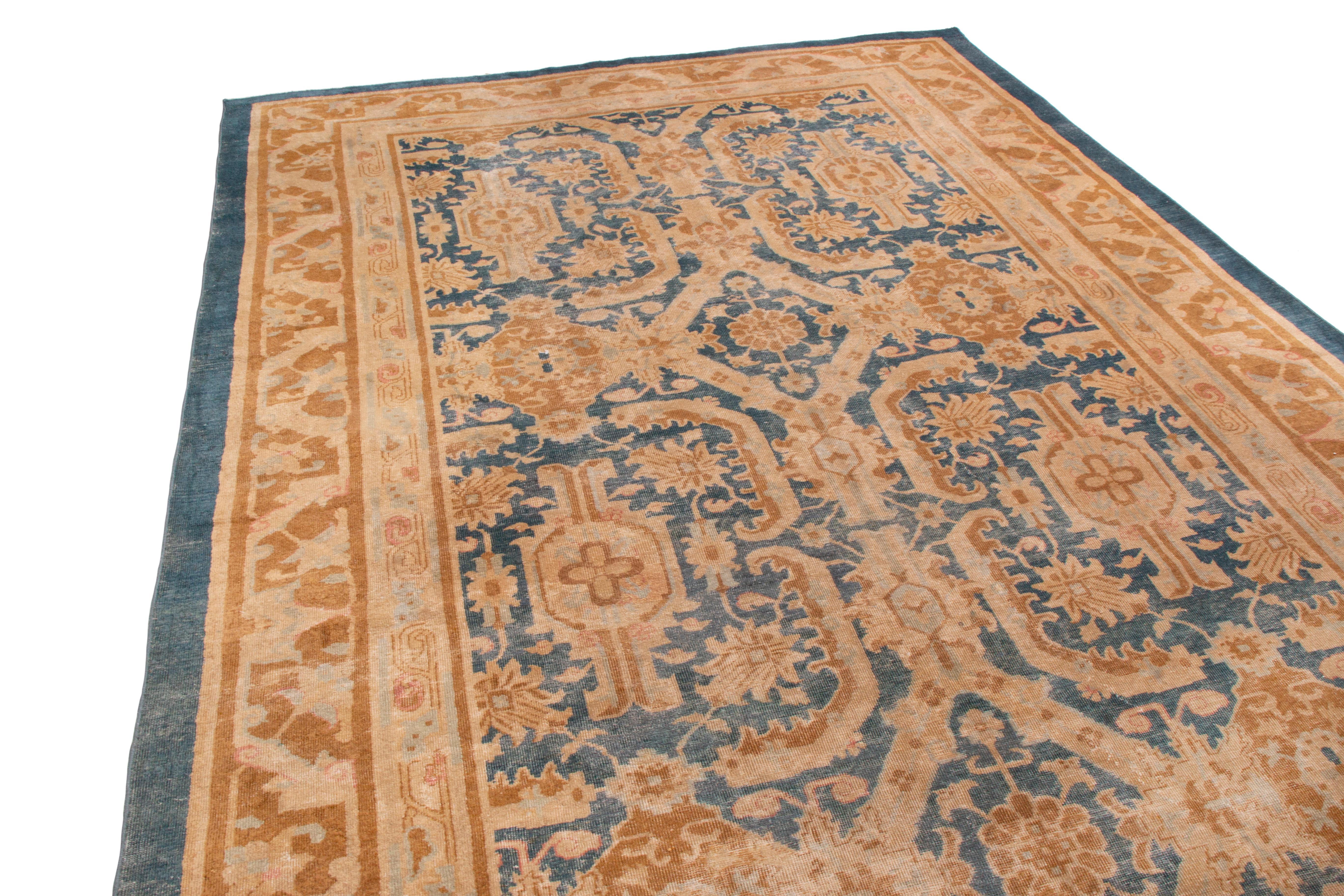 This antique traditional Mahal wool rug is from between turn-of-the-century to 1920 India, resembling many Shahrestan pieces in origin. Featuring both a large format and large drawing, like many Mahal pieces the wool is more finely woven than most