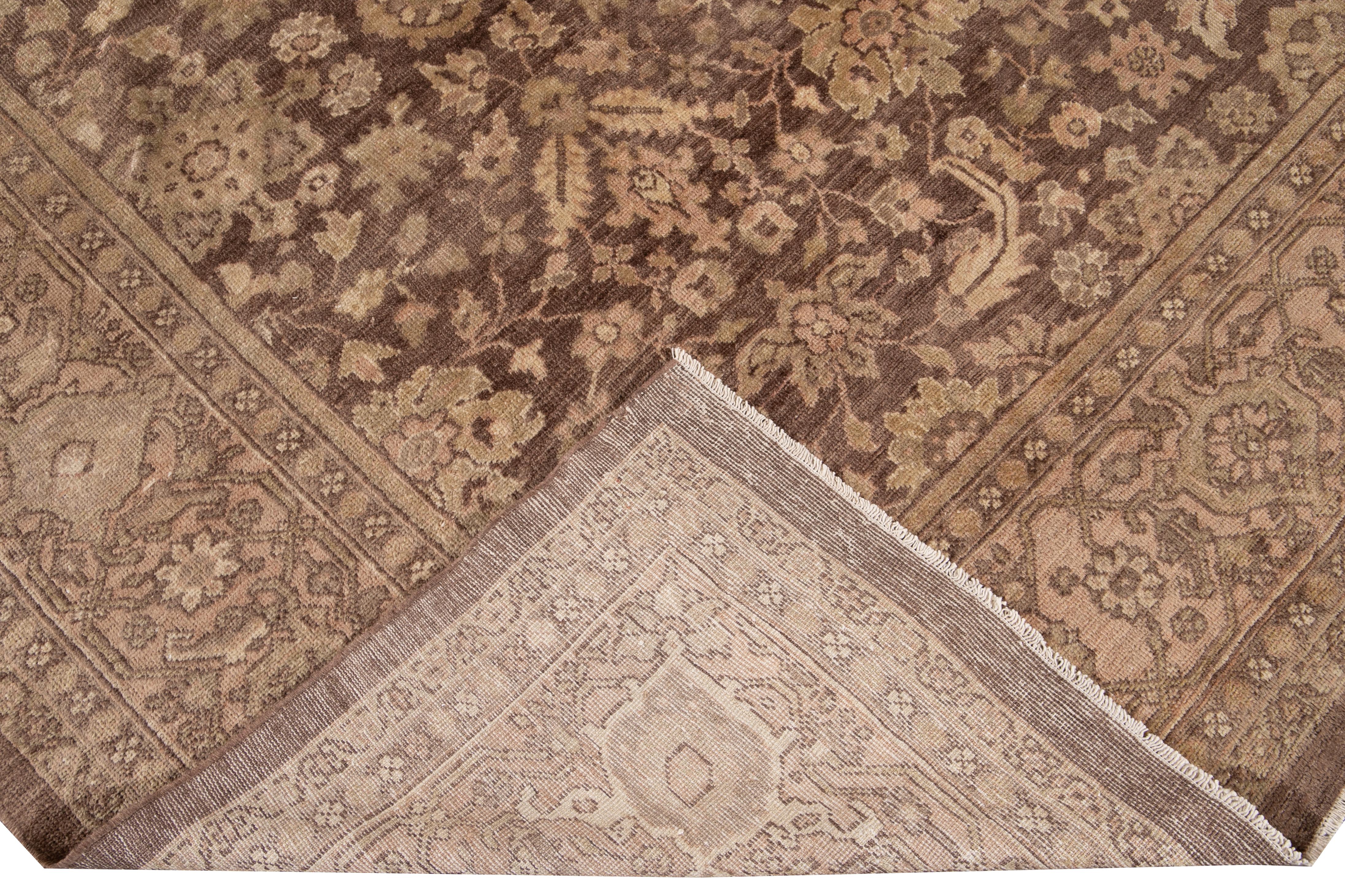 Beautiful antique Mahal hand knotted wool rug with a maroon field. This rug has a peach frame and beige accents in a gorgeous all-over geometric floral distressed design.

This rug measures 9'10
