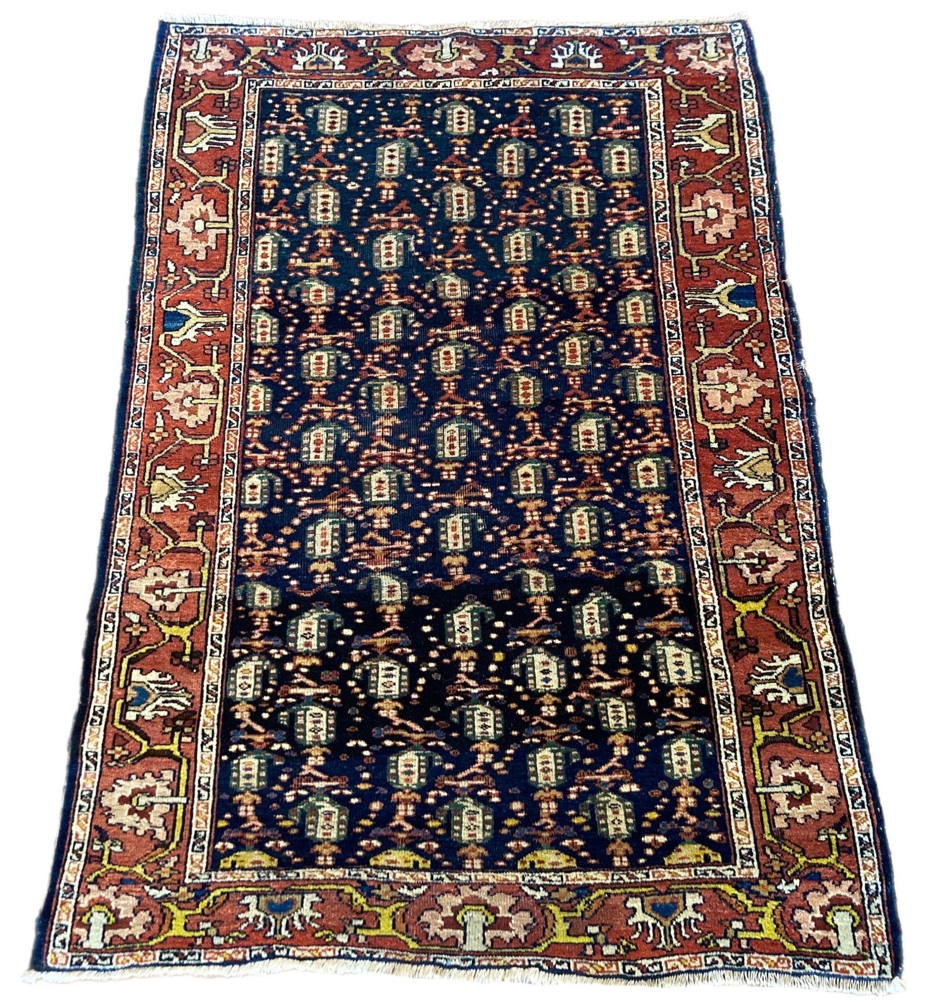 A beautiful little antique Mahal rug, handwoven circa 1910 with an all over Boteh design on a deep indigo field and terracotta border. Lovely secondary colours of green and gold throughout and a charming little rug.
Size: 1.51m x 1.02m (5ft x 3ft