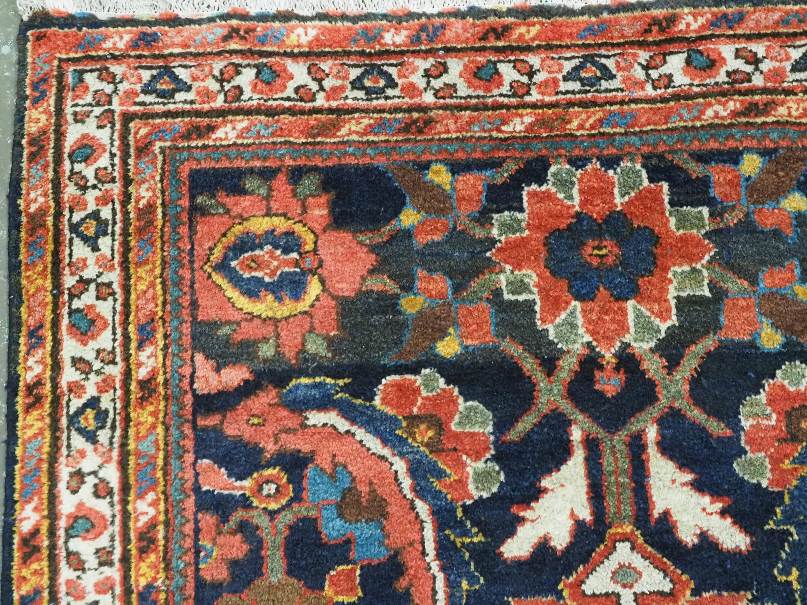 Wool  Antique Mahal rug with large scale floral design.  Circa 1920. For Sale