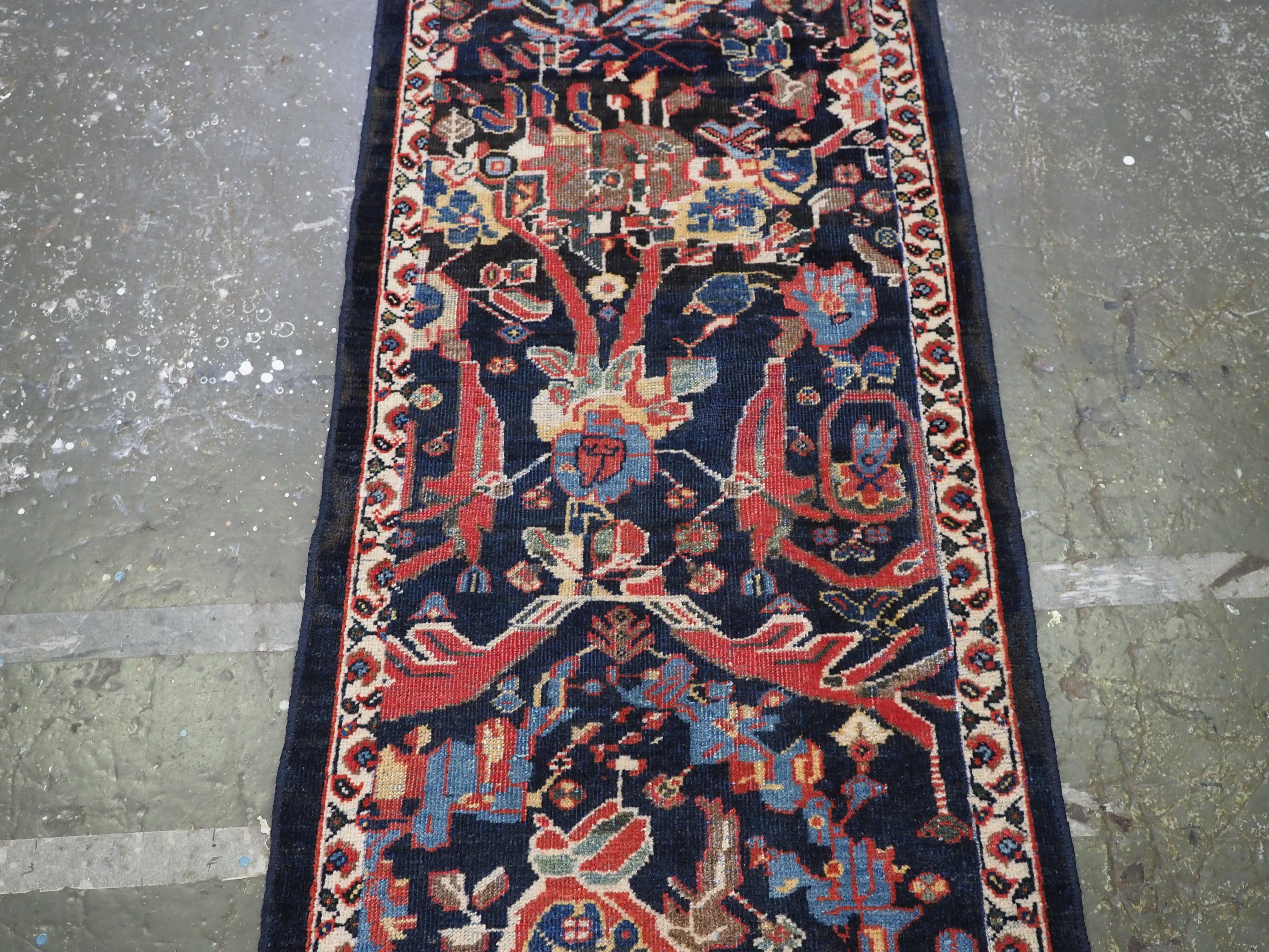 Antique Mahal runner of a very scarce narrow width.  Circa 1900. In Good Condition For Sale In Moreton-In-Marsh, GB