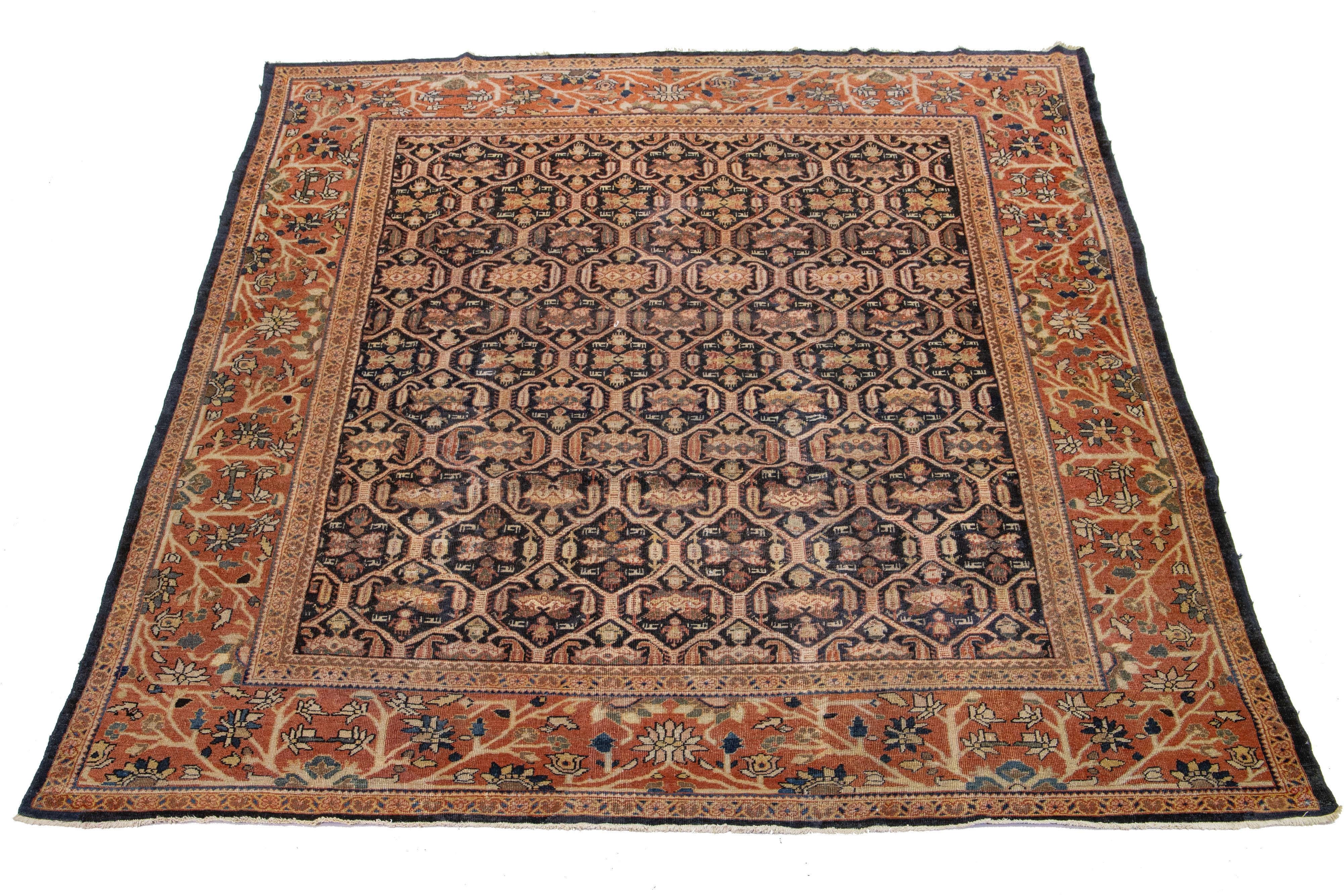 Beautiful antique Mahal hand-knotted wool rug with a dark blue field. This Persian rug has a Classic blue, rust, and brown design.

This rug measures 10'1