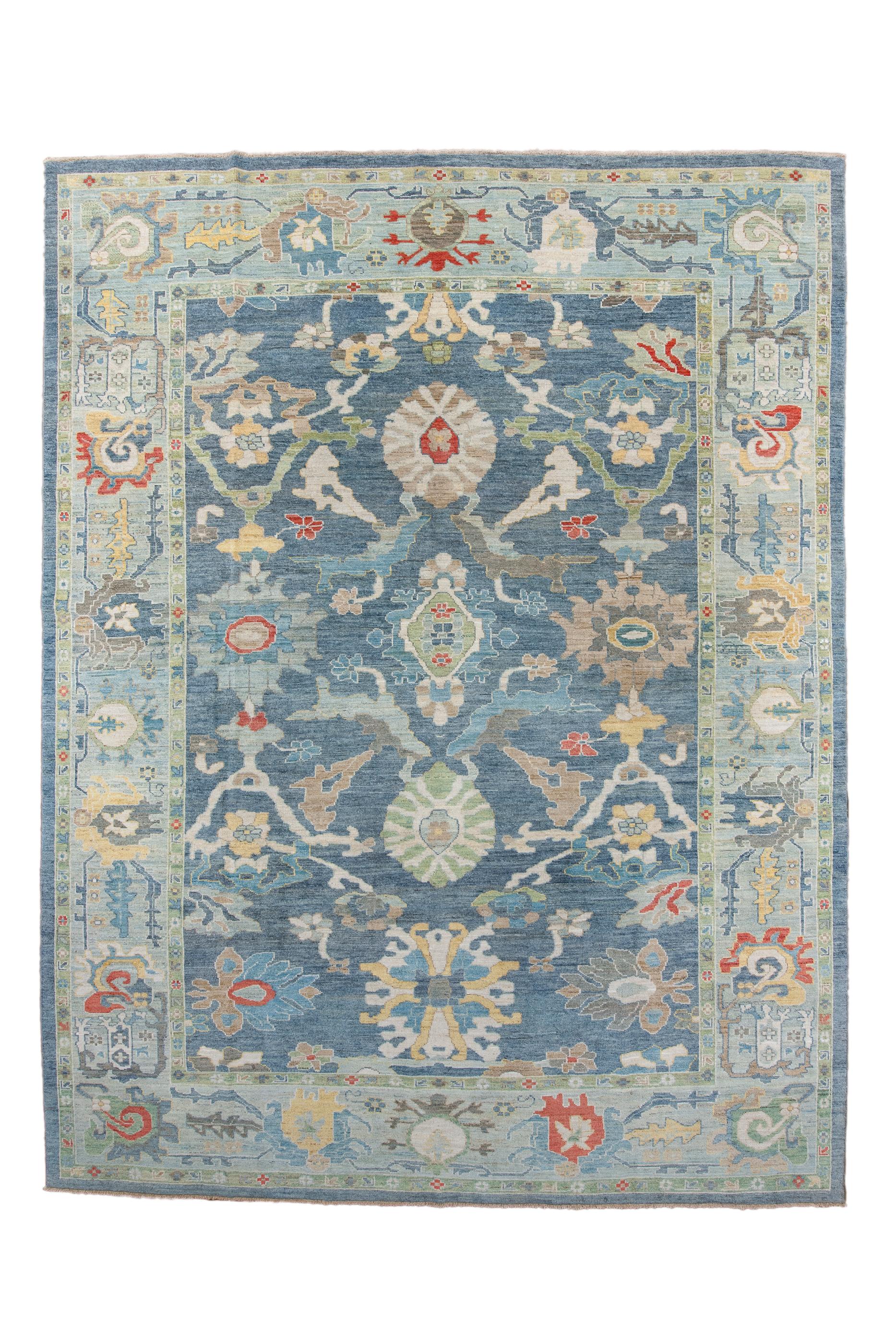 This very attractive village carpet shows a Ziegler-like large palmette pattern in ovals and various ragged palmettes, on an abrashed teal-blue ground, with light blue, straw, goldenrod and salmon secondary tones.  Abrashed powder border with large,