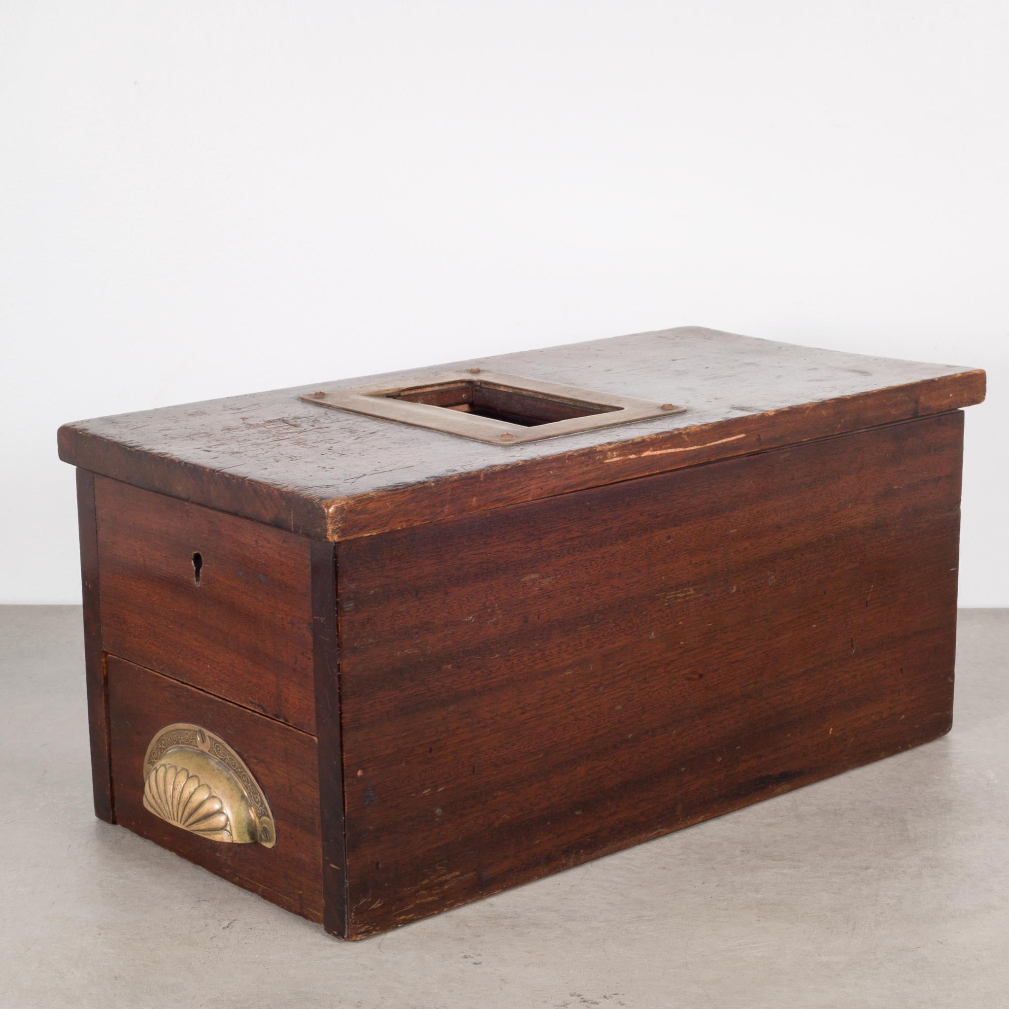 About:

This is a mahogany cash till with original enameled lid and logo. The pull out / pull-out drawer rings a brass bell and moves the paper receipt roller. The original label and instructions are on the inside of the lid.

Creator: G.H.