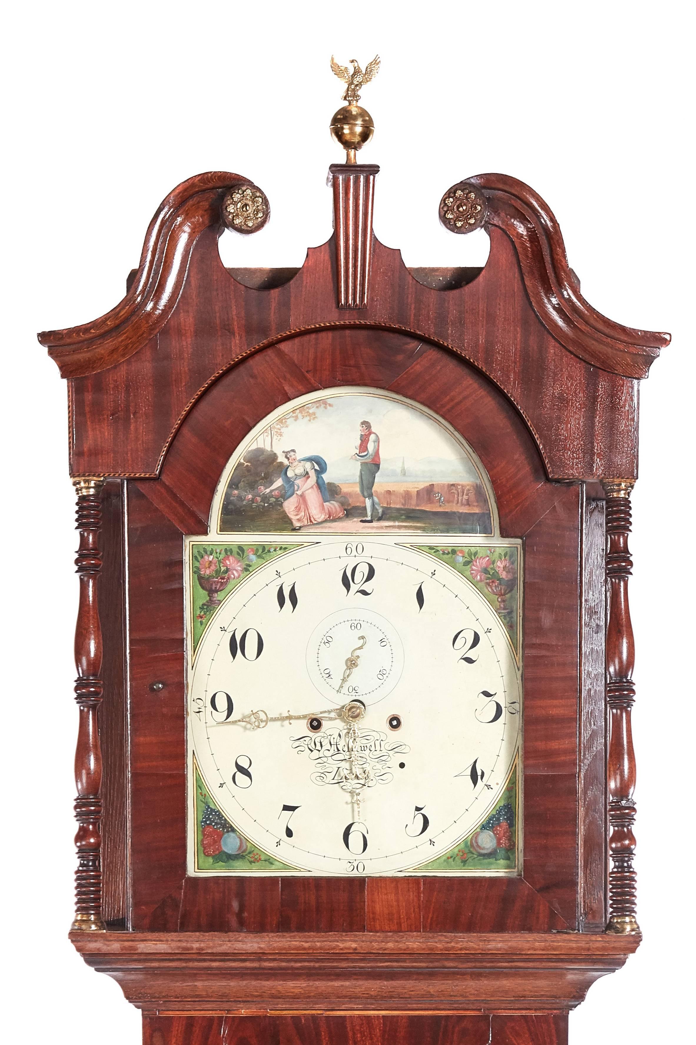 Antique mahogany and oak 8 day longcase clock, W Helliwell Leeds, with a swan-neck pediment, brass finial, turned columns to the hood, lovely mahogany and oak case with satinwood stringing, standing on lovely shaped bracket feet, lovely decorative