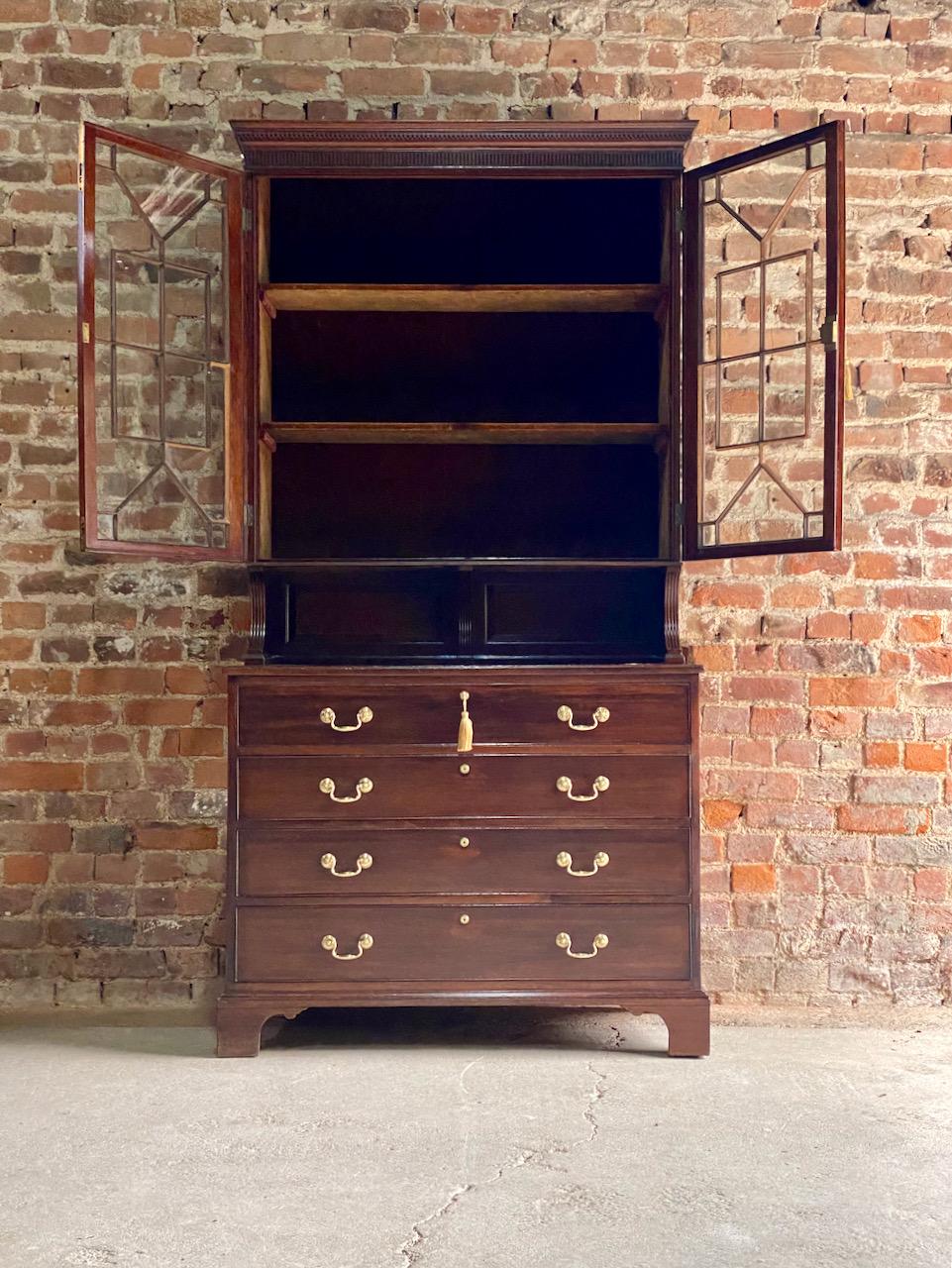 Magnificent 19th century Victorian mahogany astragal bookcase secretaire England circa 1875, the galleried upper section with corniced top with dentil moulding over two astragal glazed doors with elegant geometric design, brass detail to front of