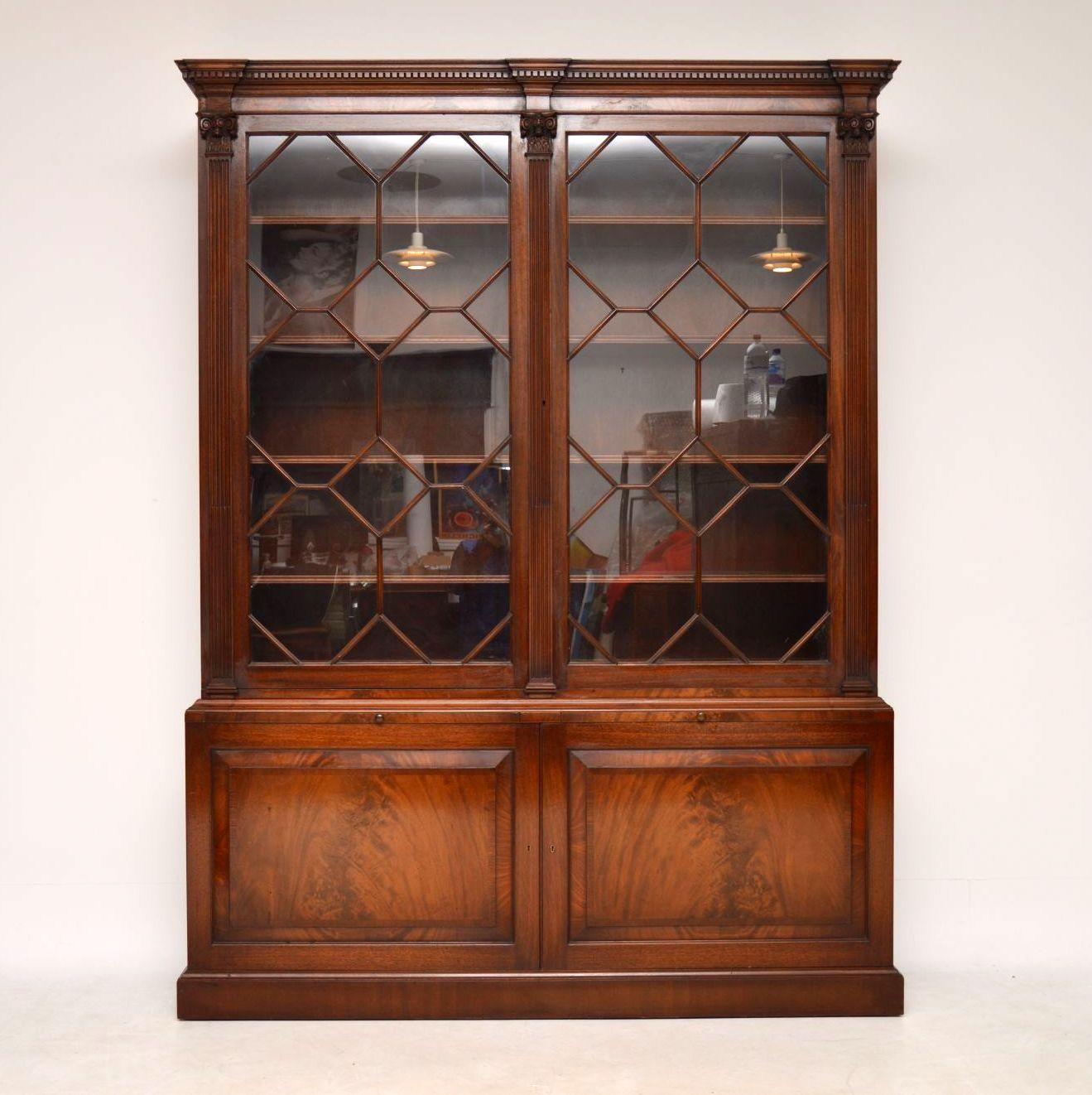 Very impressive large antique mahogany bookcase over cupboard in good condition & dating from around the 1930’s period. Please enlarge all the images, especially the one with the doors open to appreciate all the fine features & the understand the