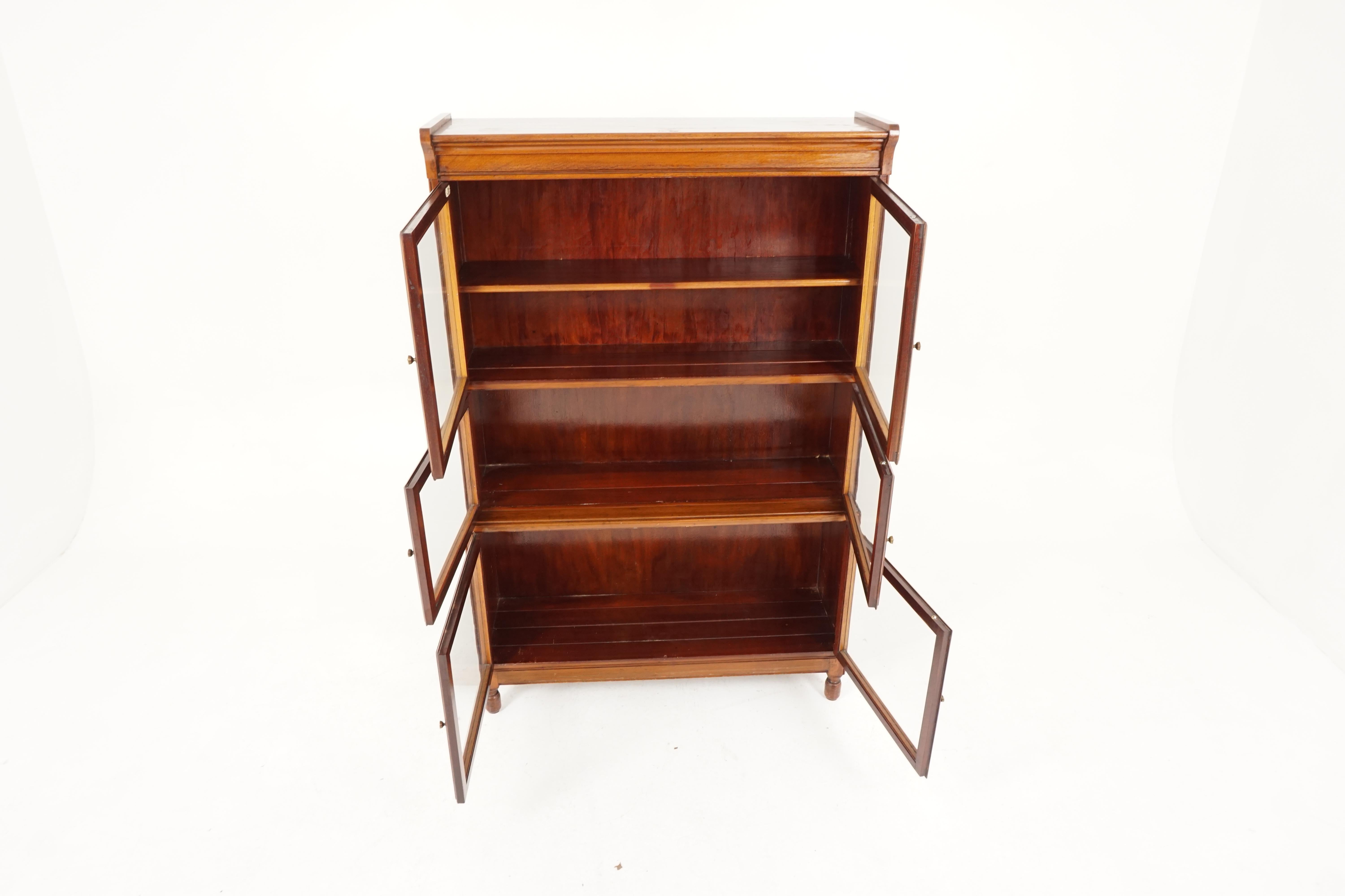 Antique three-tier bookcase, Walnut lawyer sectional bookcase, by Minty, England 1920, B2159

England 1920
Solid Walnut
Original finish
Rectangular top
Pair of large double double glass doors with one adjustable shelf
Below a single section with