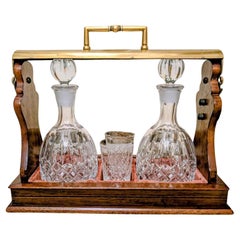 Antique Mahogany 
Brass Tantalus With Cut Glass Decanters And Glasses