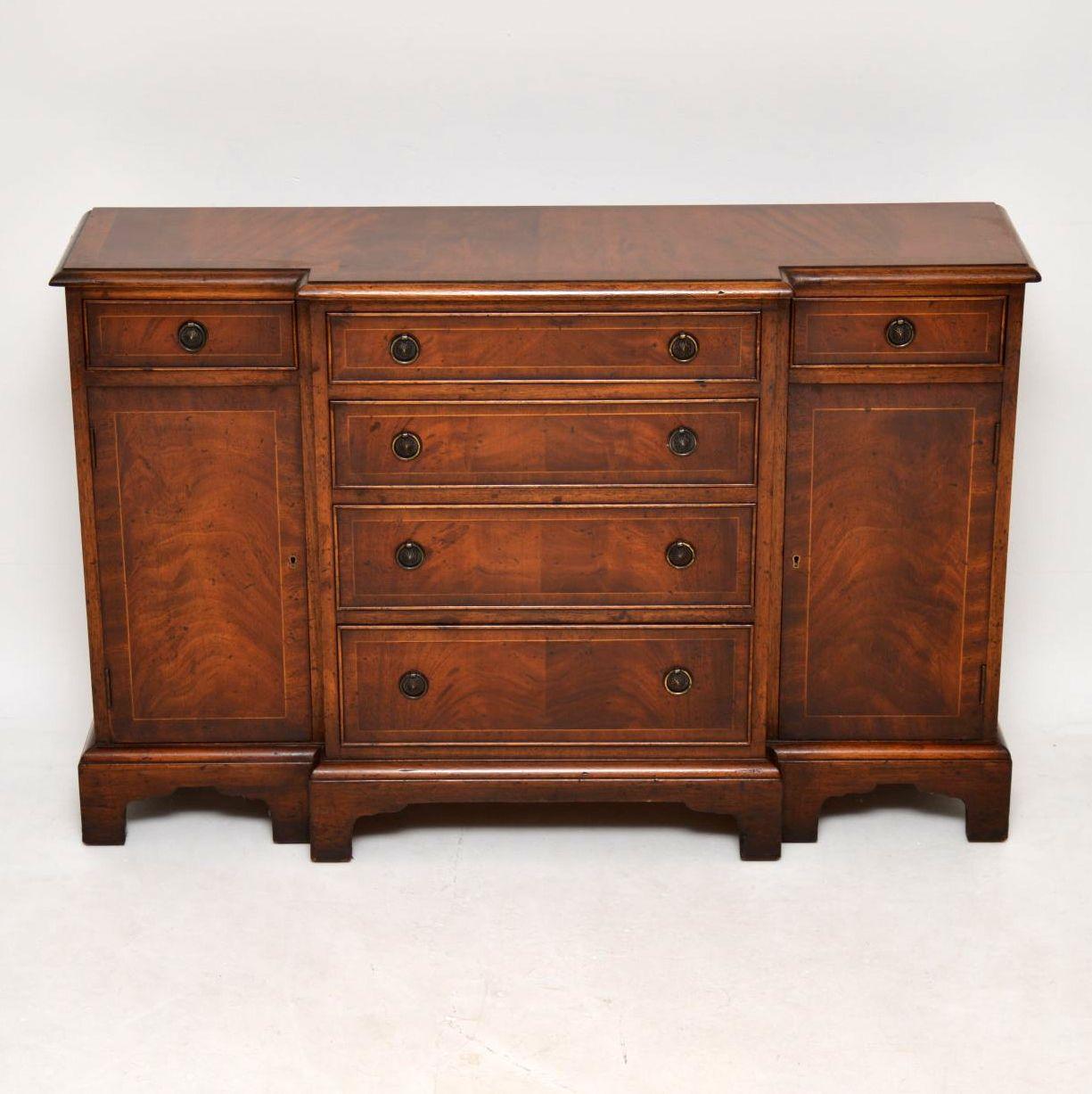 Small antique flame mahogany breakfront chiffonier sideboard in good original condition, showing a lot of character, good patina, wonderful figuring and natural ageing. The top is cross banded and inlaid as are the drawers and cupboards. The drawers