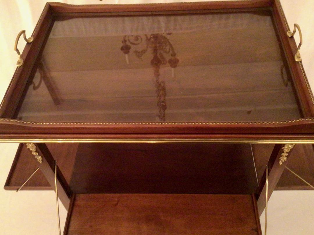 This is a lovely serving cart. The top is glass-covered. 
Dimensions for the cart closed appear in the listing. Dimensions for the cart open are 37.75 inches wide and 29.75 inches deep.