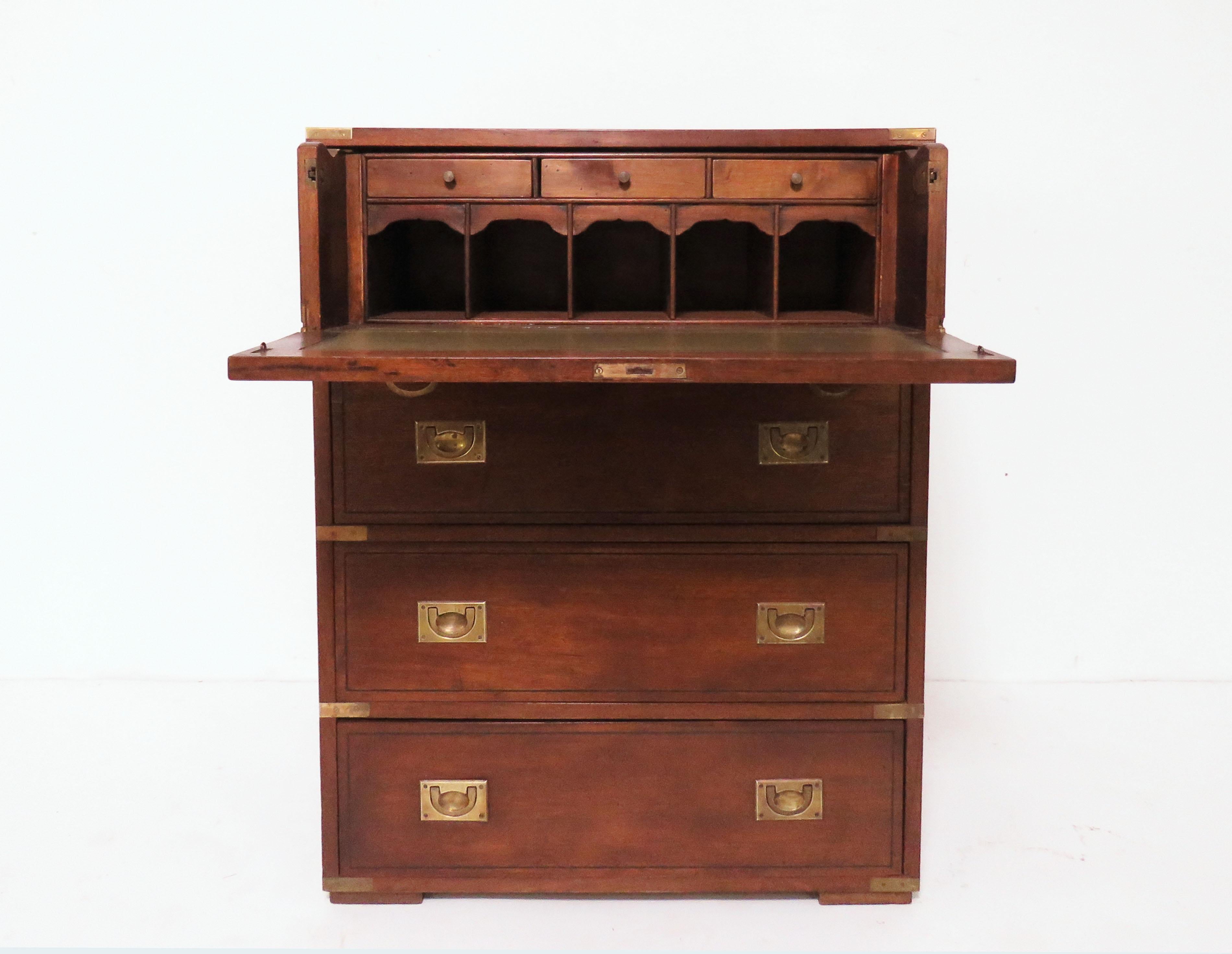 Antique English solid mahogany officer’s campaign chest with drop down desktop drawer, circa 1890s. Leather writing surface, storage drawers, brass hardware and carry handles. Closed size 36.25” high, 15.5” deep, 28.25” wide. 27.75” deep with