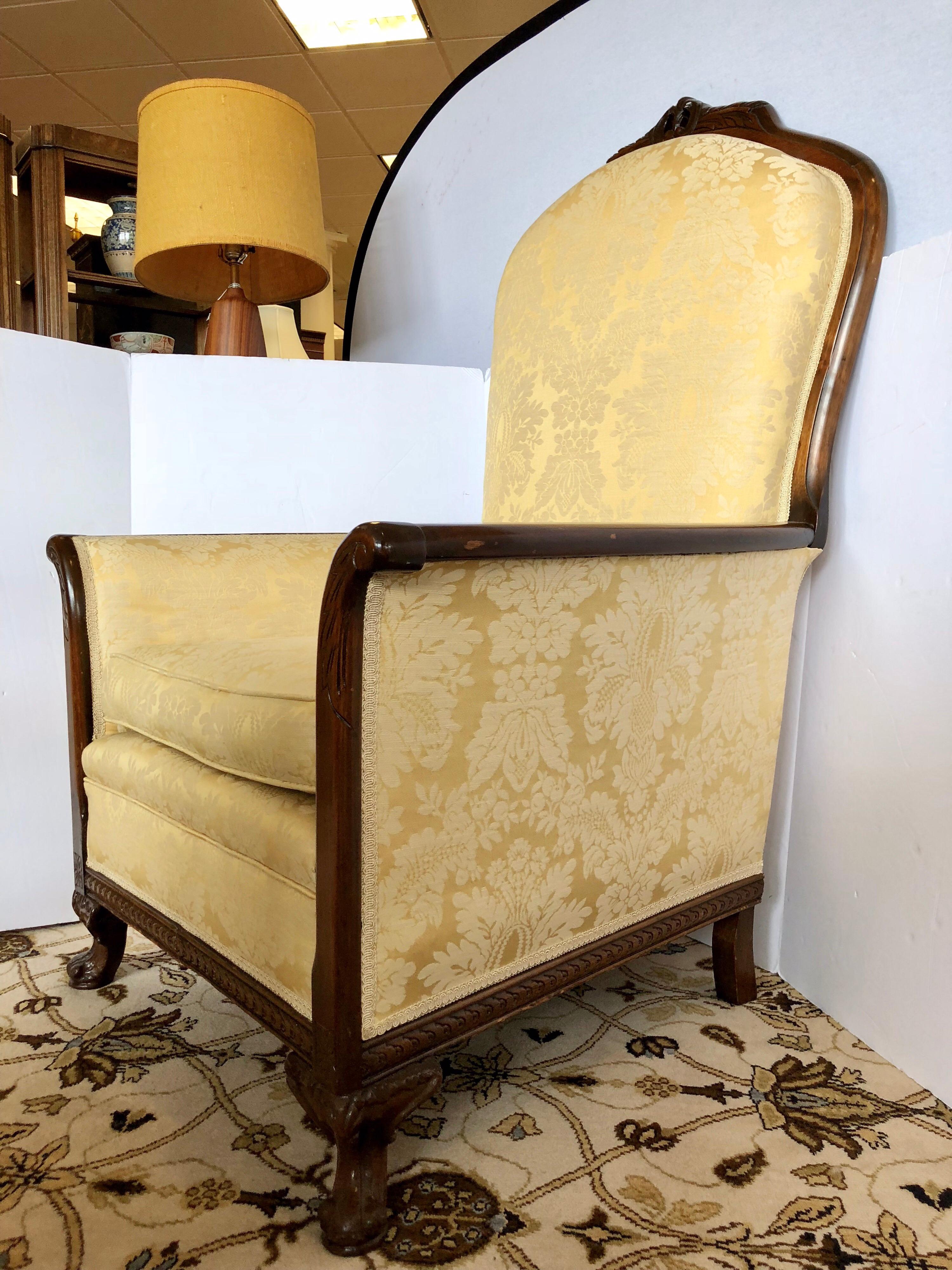 Elegant and substantial high back carved George III chair with to die for golden upholstery.