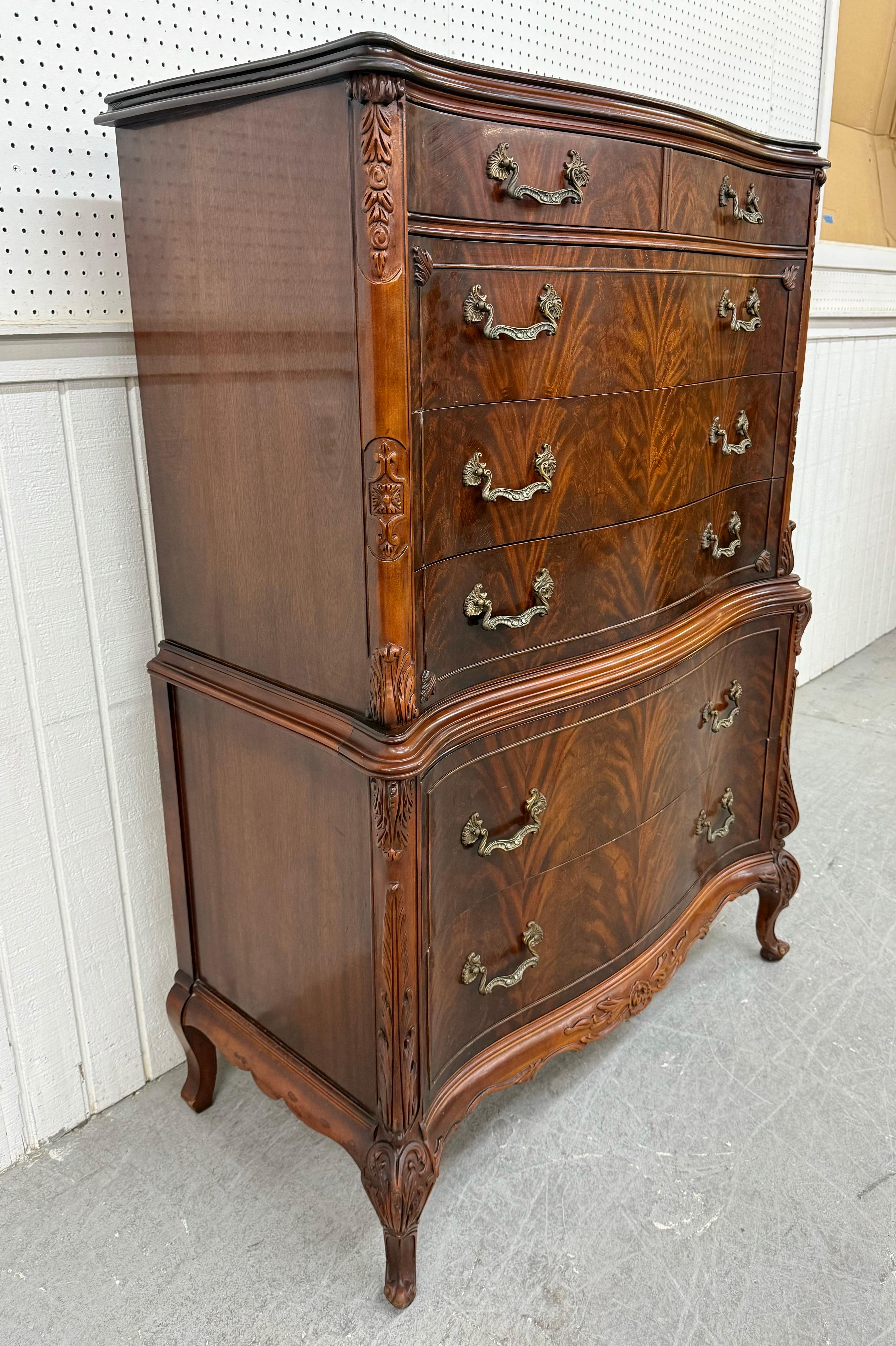 This listing is for an Antique Mahogany Carved Swan High Chest. Featuring an antique style, six drawers for storage, original brass pulls, carved accents, and a beautiful flame mahogany finish. This is an exceptional combination of quality and