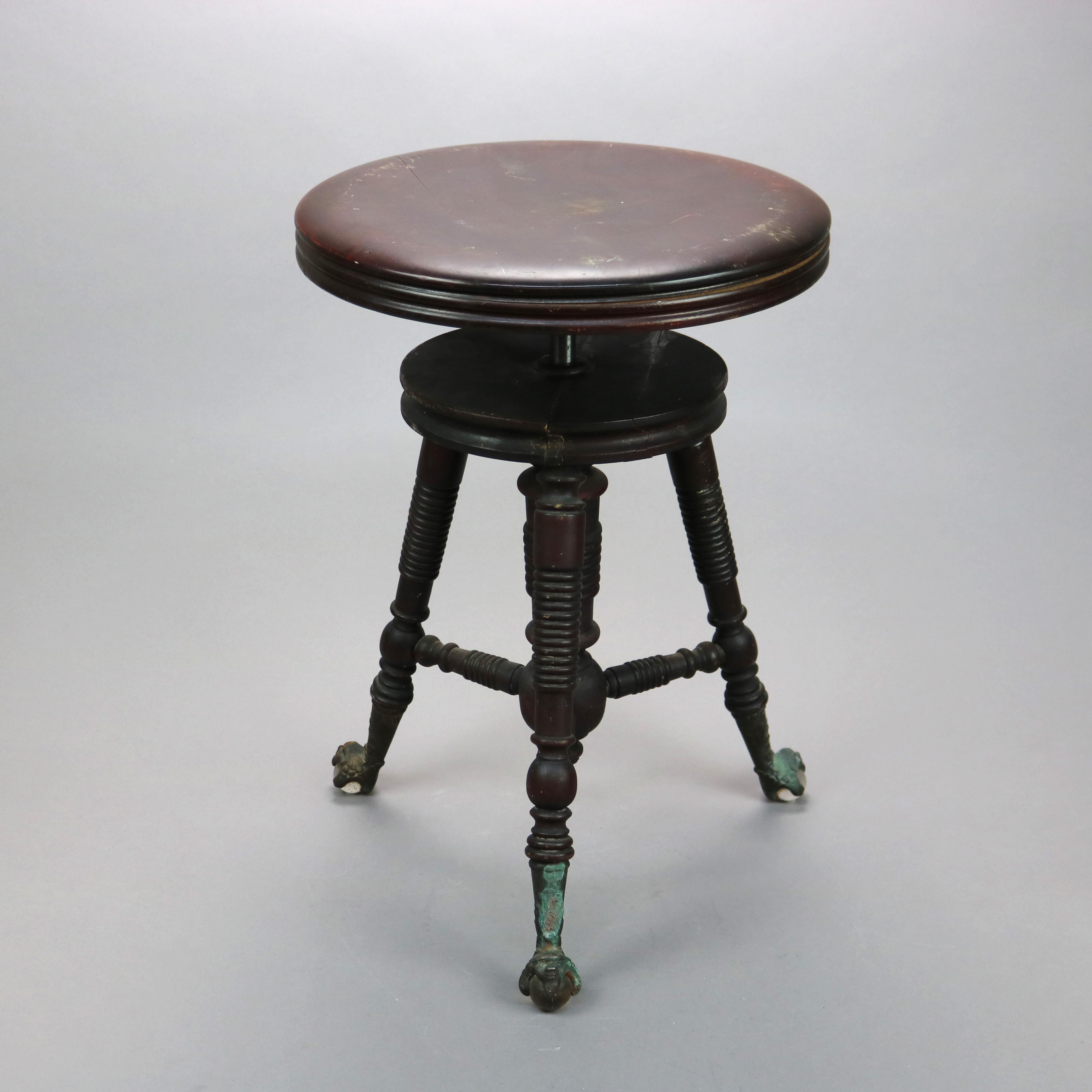 An antique piano stool offers mahogany construction with adjustable seat over balustrade legs terminating in claw and glass ball feet, c1900

Measures - 19''H x 21''W x 21''D.

Catalogue Note: Ask about DISCOUNTED DELIVERY RATES available to most