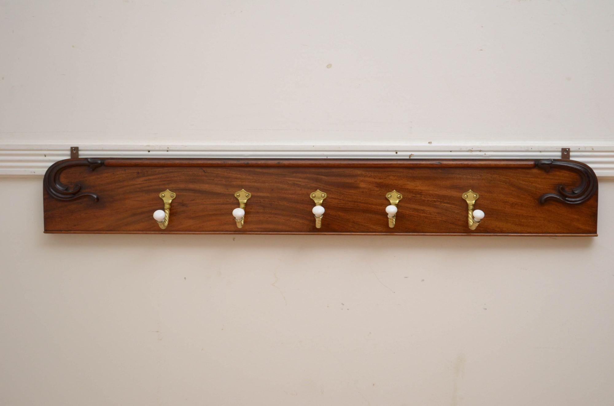 K00300 Stylish and practical antique coat hooks with five very decorative, twisted rope hooks with ceramic ends on on William IV figured mahogany backing with finely carved scrolls, all fitted with hanging brackets, ready to place at home. XIXth
