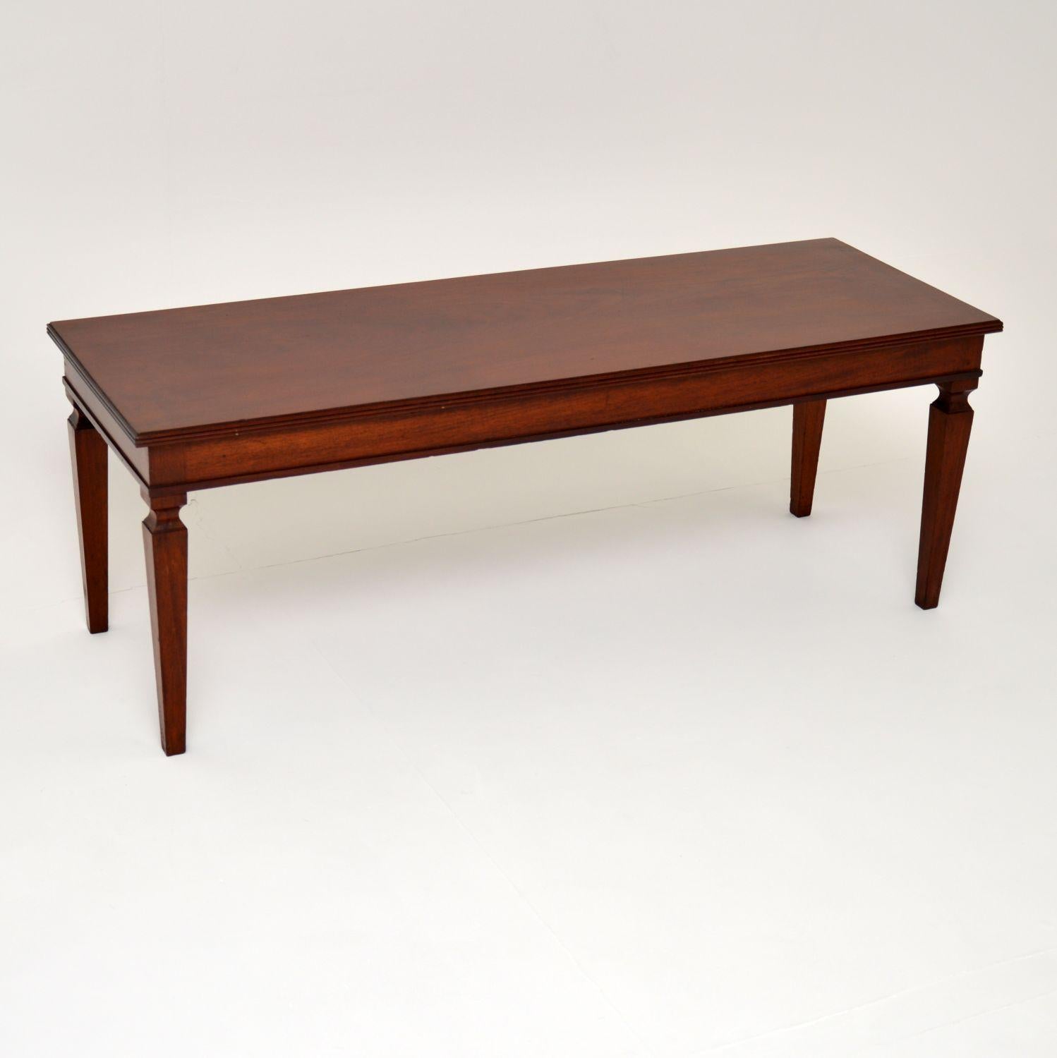 A stylish and very well made antique coffee table in solid wood. This dates from around the 1930’s period.

It is of superb quality, with a fantastic long and slim design. It sits on sturdy yet elegant tapered legs, this is a very useful