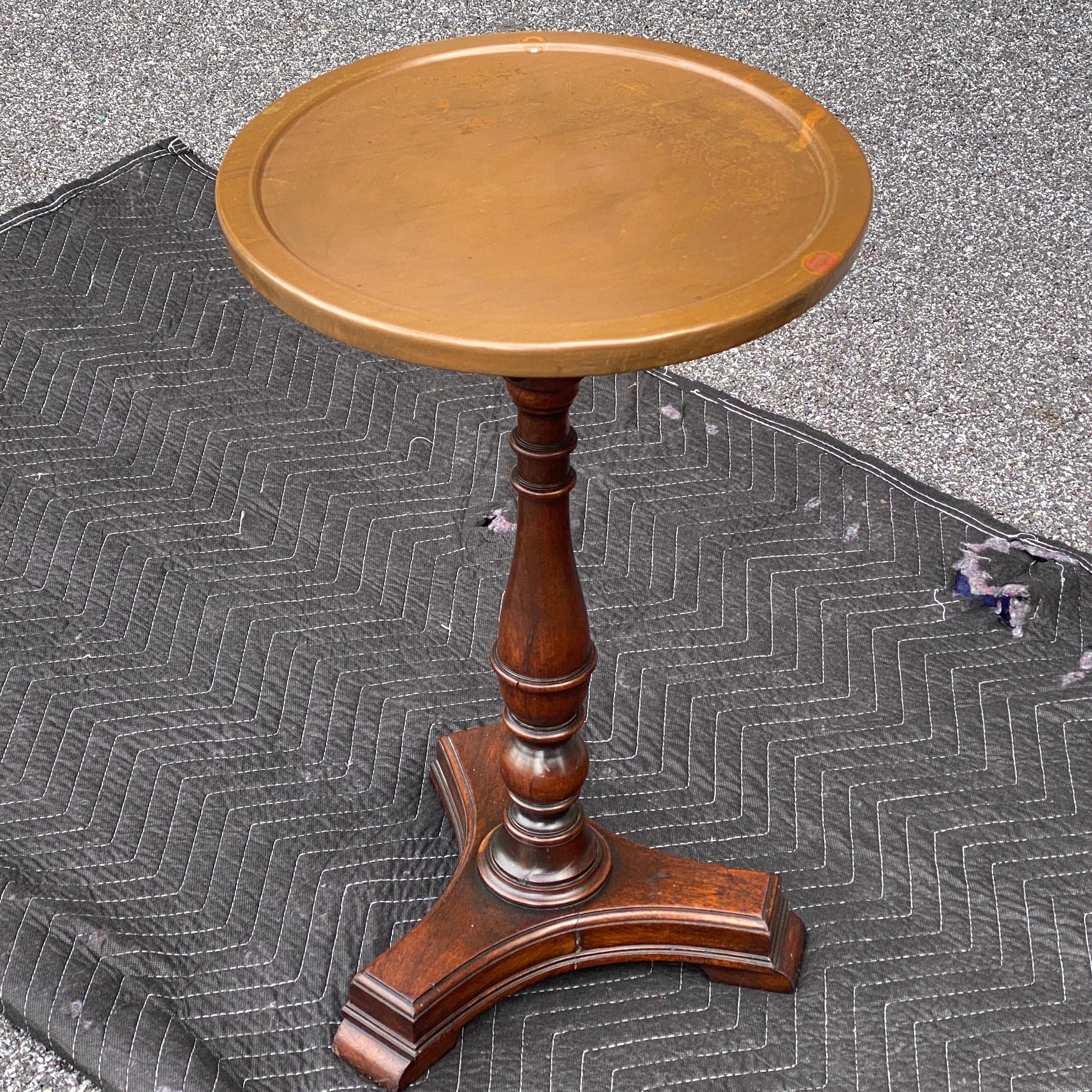 Antique copper topped turned solid mahogany pedestal drinks table, side table, or plant stand.
13” diameter inside ridge of copper top surface. Marked L265 under base.