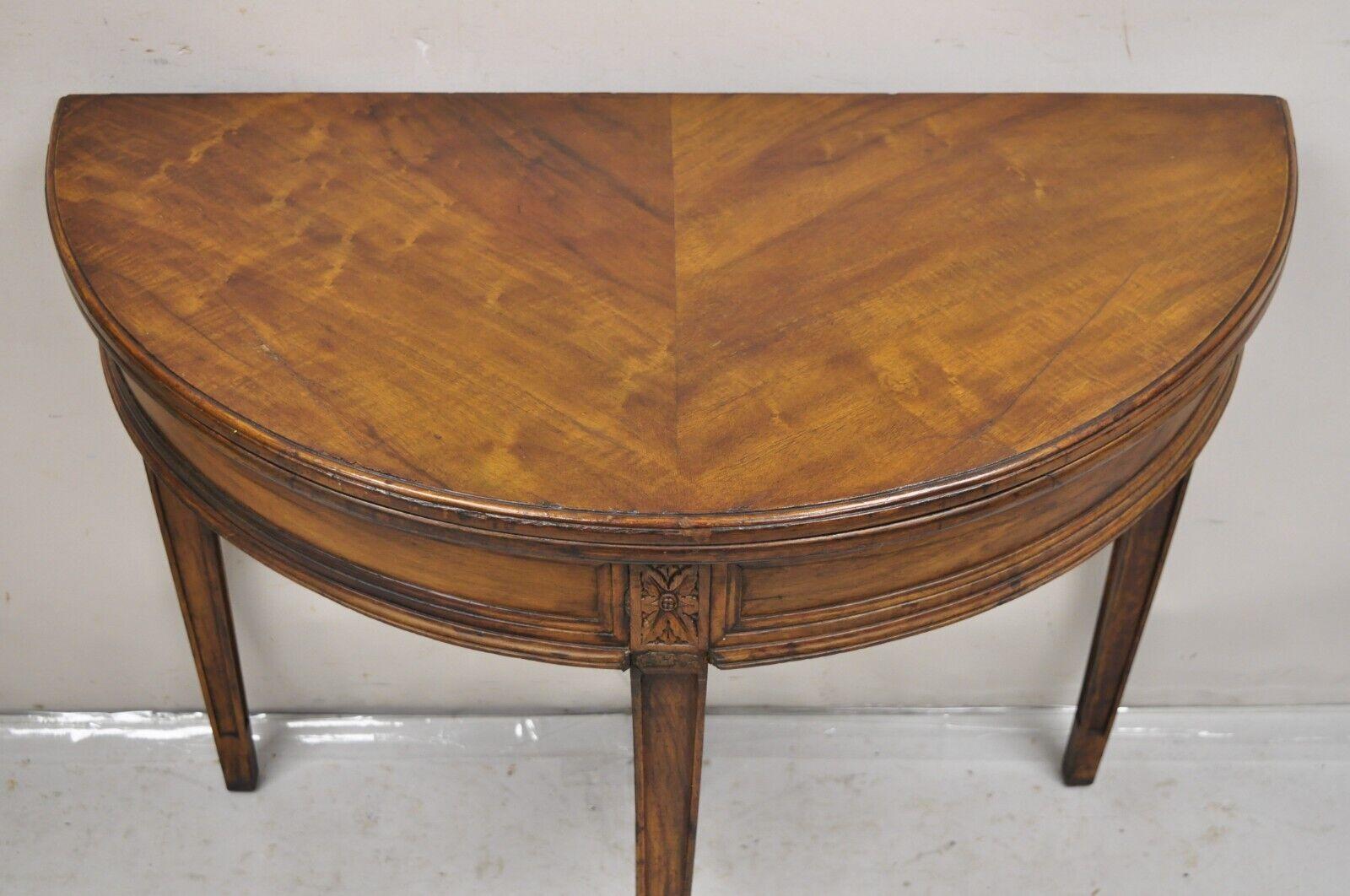Antique Mahogany Demilune Flip Top Console Game Table with Rear Drawer. Item features a hidden pull out rear drawer with hand dovetail, flip top, nicely carved details, beautiful wood grain, very nice antique item. Circa  19th Century.
Measurements: