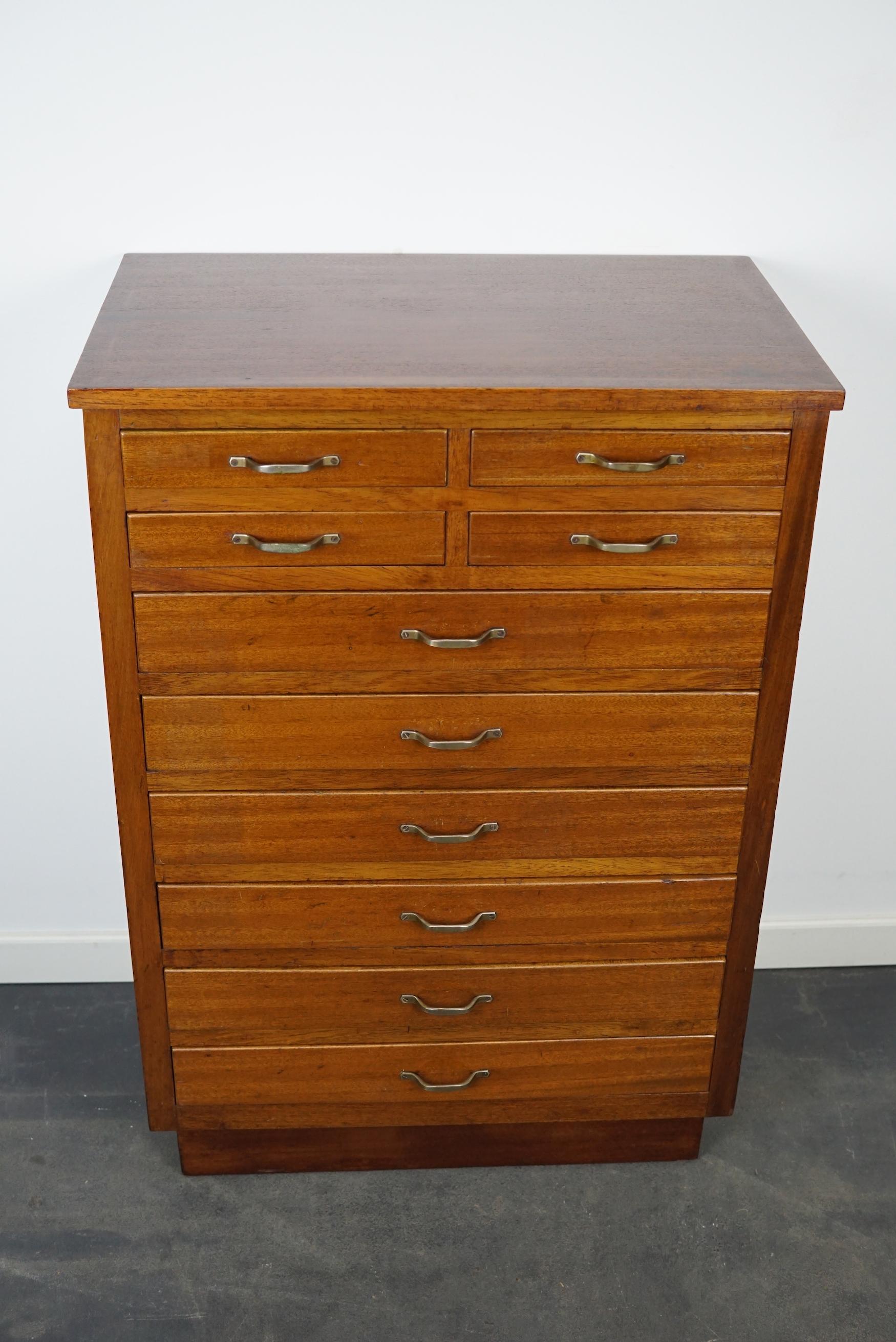 This dentist cabinet was designed and made circa 1930 in Amsterdam, The Netherlands. It features many small mahogany fronted drawers in two different sizes: DWH 30 x 24 x 3.5 and 30 x 52 x 6 cm. It was used to store dentist supplies and tools.
 