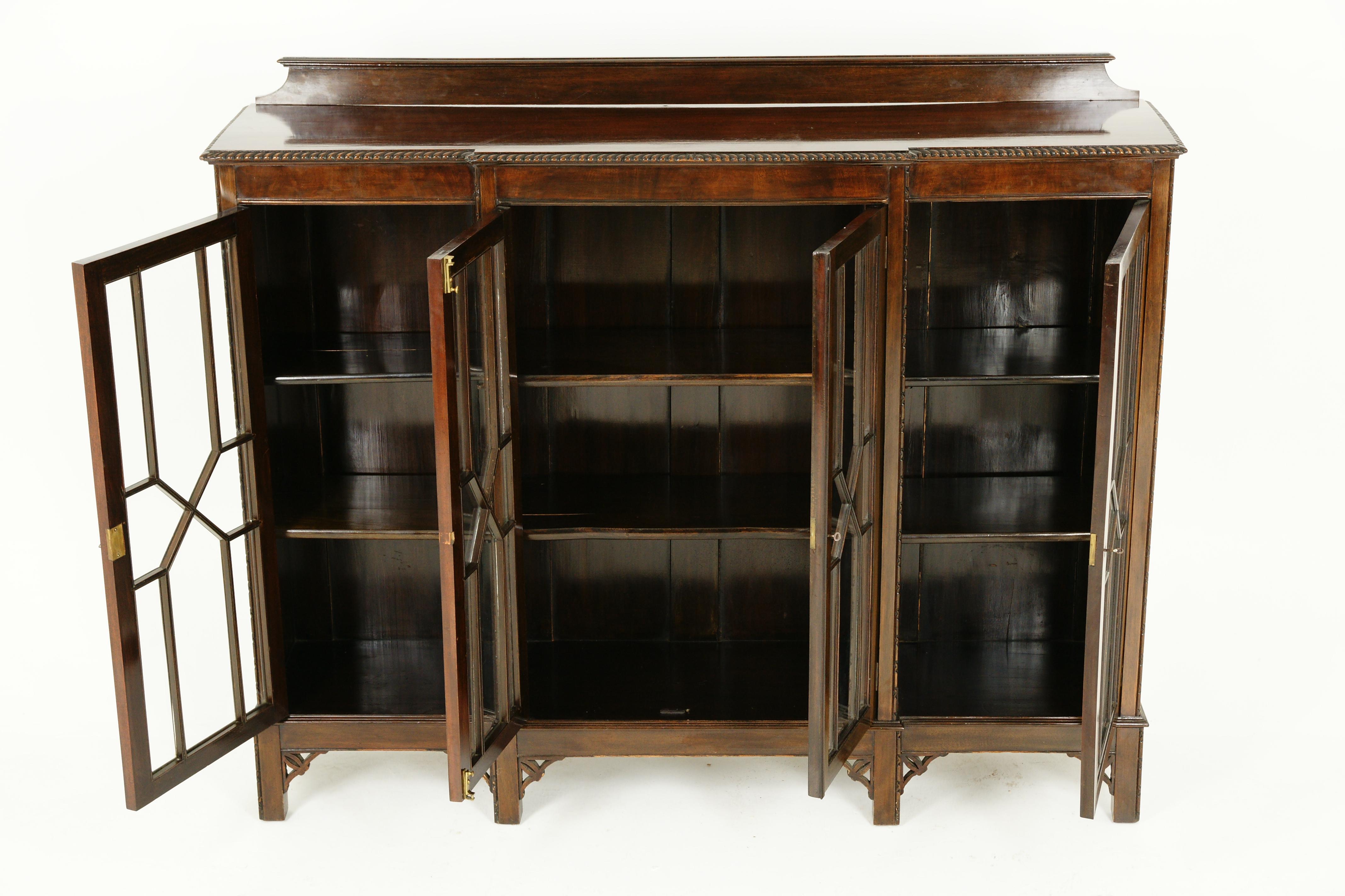 Antique walnut display cabinet, Chippendale style, 4 door breakfront bookcase, Scotland 1920, B2437

Scotland, 1920
Solid walnut
Original finish
Has scalloped out and carved top edge
Shaped pediment on top
Four original glass doors, all of which can