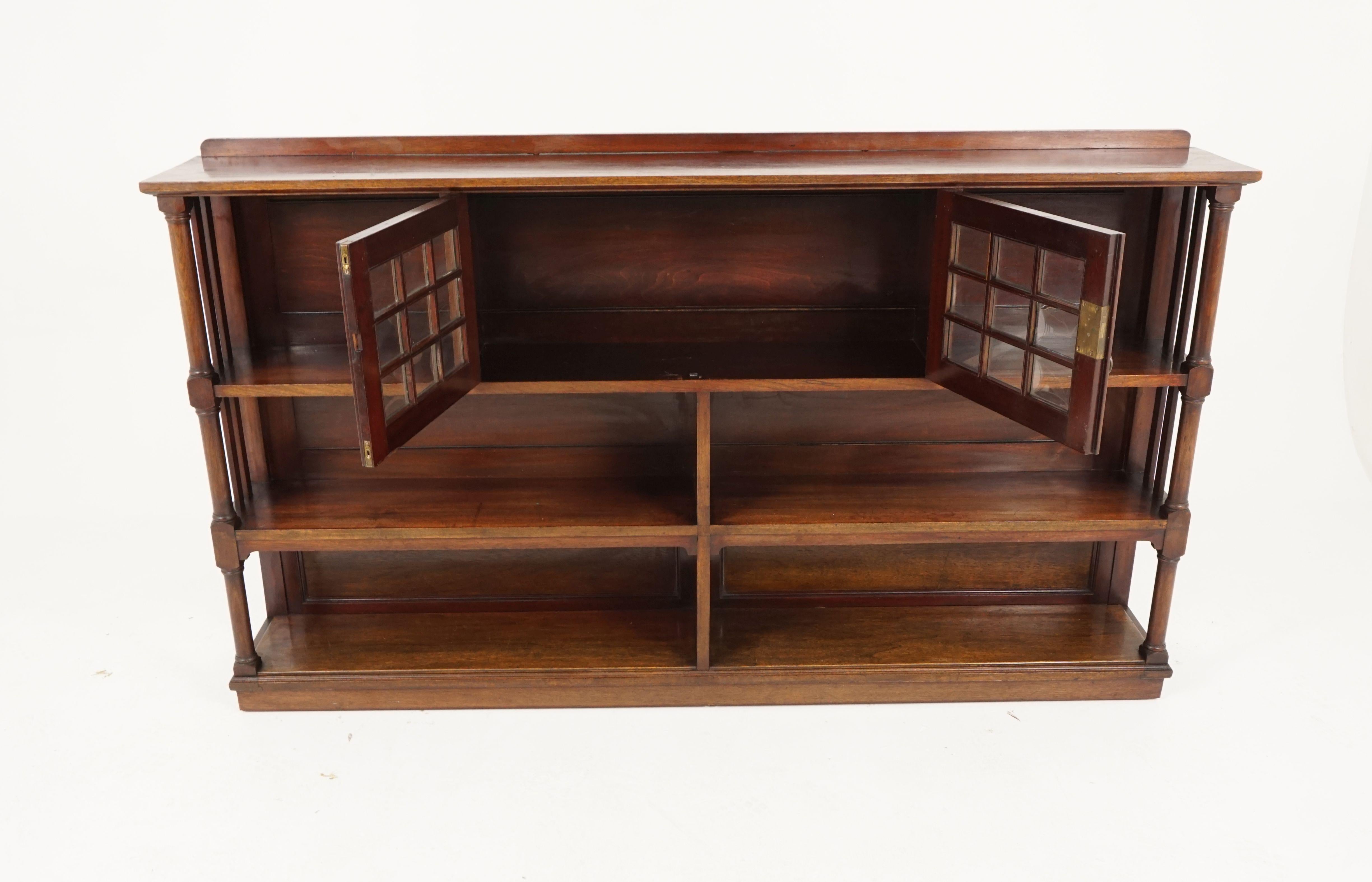 Antique Walnut display cabinet, open bookcase, Scotland 1910, B2255

Scotland, 1910
Solid Walnut 
Original finish
Short pediment on top
Rectangular cornice
Pair of convex glass doors
Flanked by a two short open shelves on top
Four open shelves