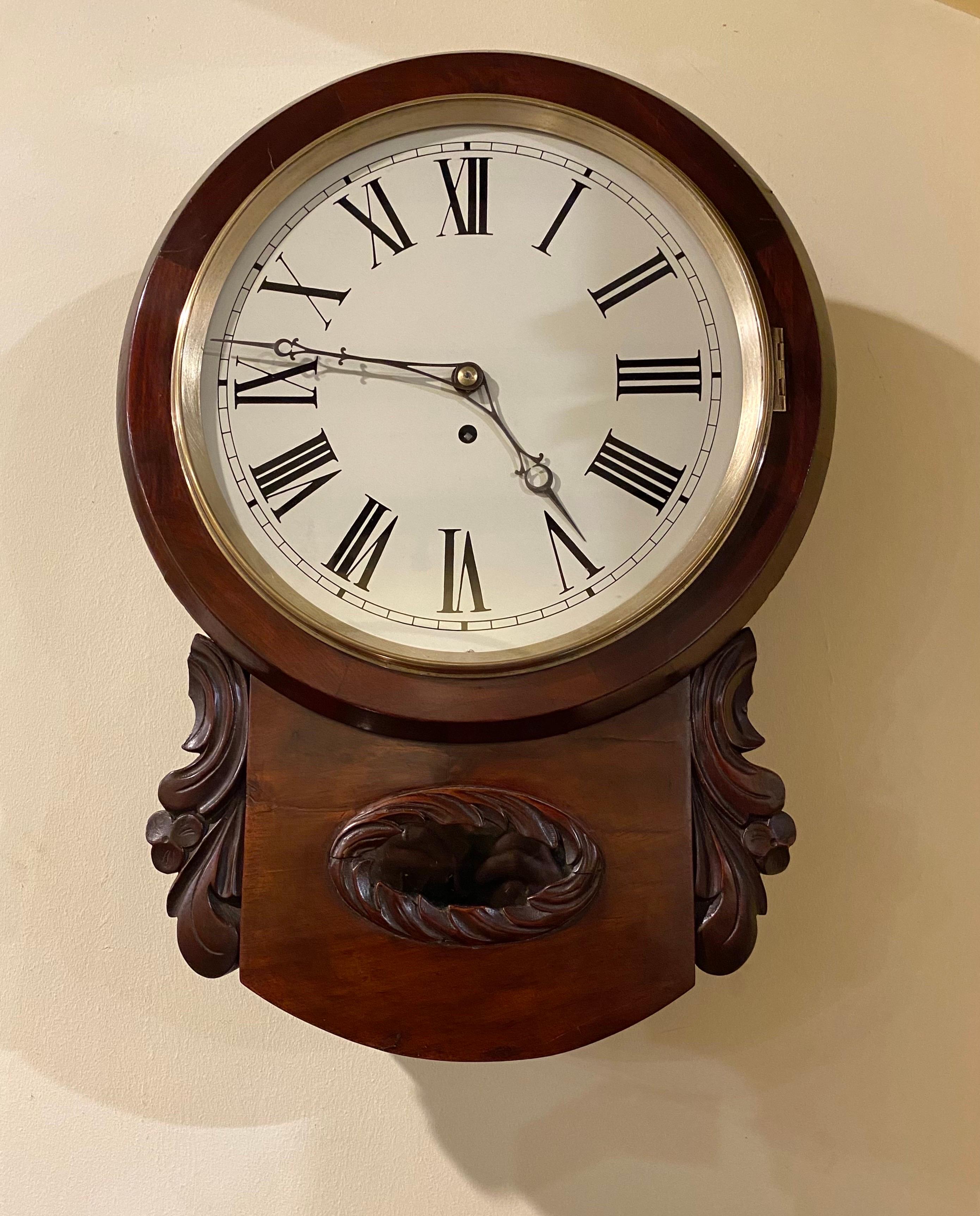 Antique Regency drop dial wall Fusee clock in lovely condition.
Mahogany case, glass door with brass bezel. Painted enamel dial. Drop dial with shaped glazed window, fusee movement. Original brass pendulum. Viewing Door that opens to the bottom &