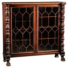 Antigua estantería de caoba de estilo Imperio con puertas de cristal