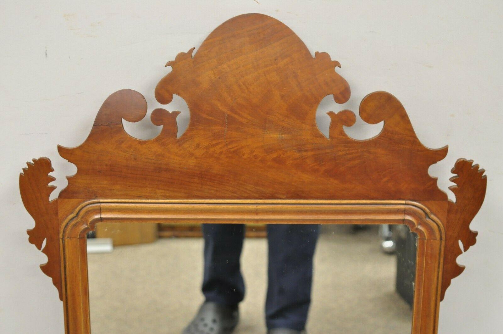 Antique Mahogany Federal Chippendale Crotch Mahogany Broken Arch Mirror. Item features a bowed pediment, crotch mahogany frame, beautiful wood grain, very nice antique item, quality American craftsmanship. Circa Late 19th - Early 20th Century.