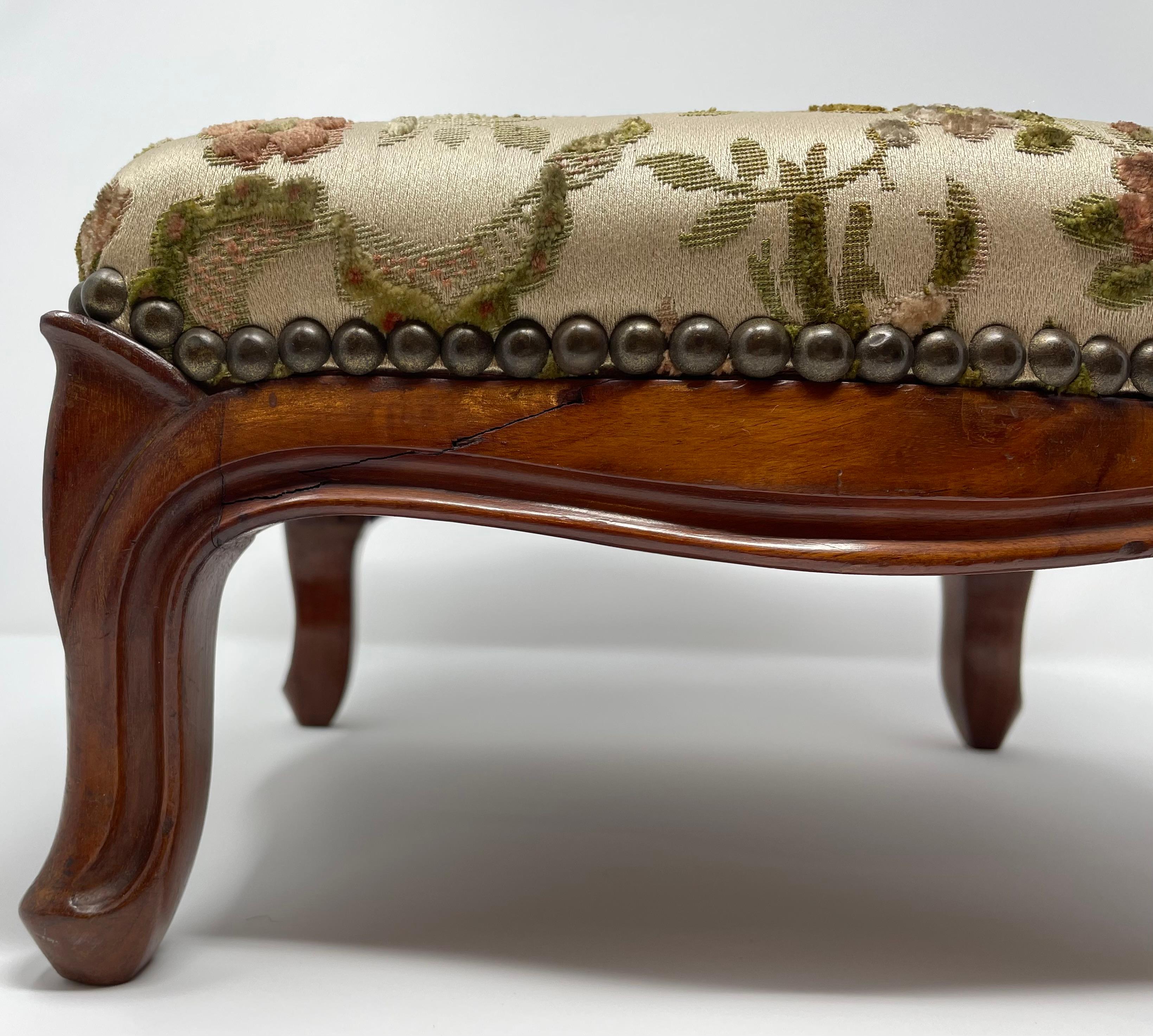 A very petite and pleasing footstool.