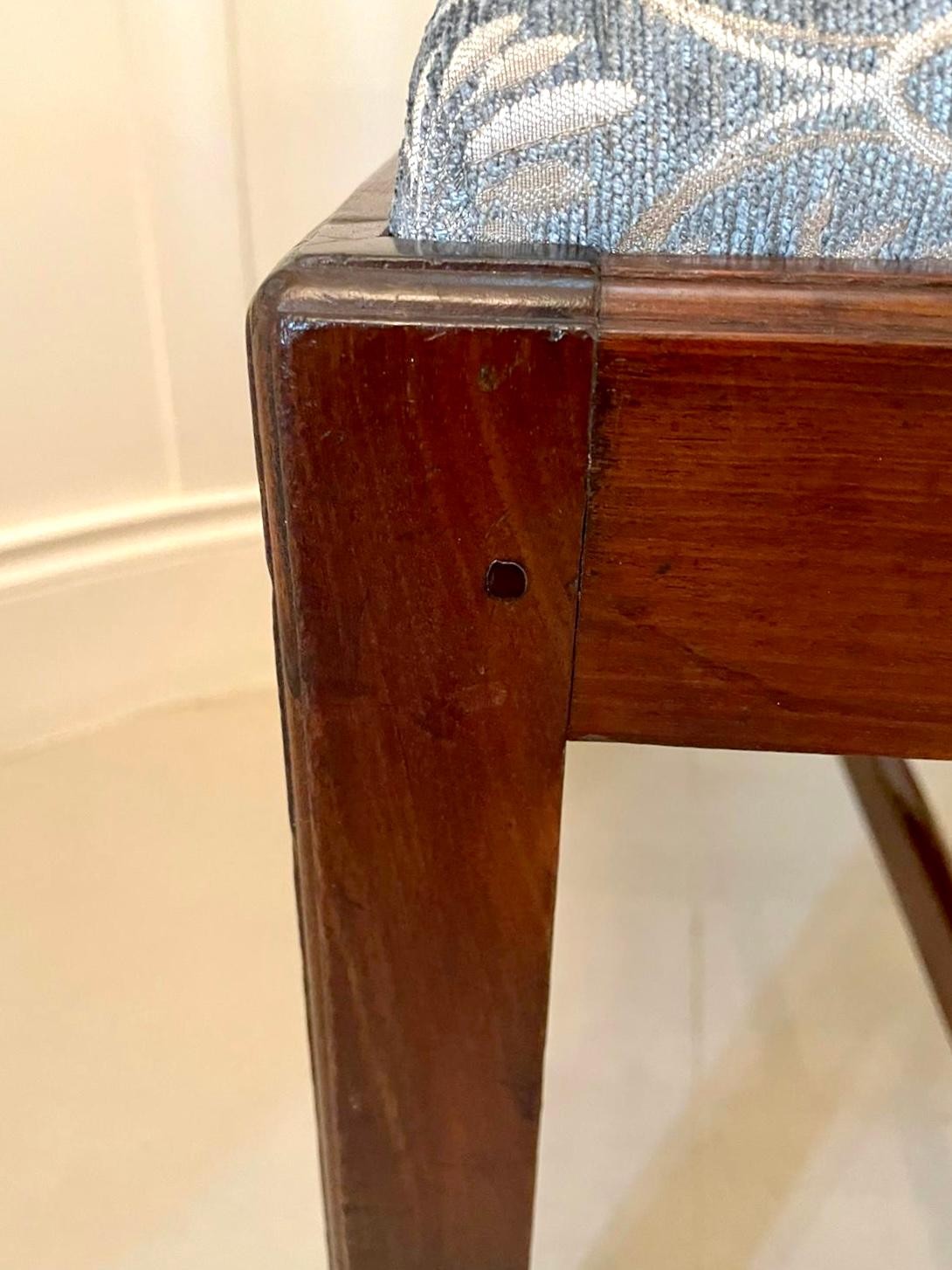 Antique mahogany footstool with a newly reupholstered seat in a quality fabric having a mahogany frieze and standing on square legs united by mahogany stretchers.

A splendid example in lovely original condition 

Measures: H 48cm
W 56cm
D