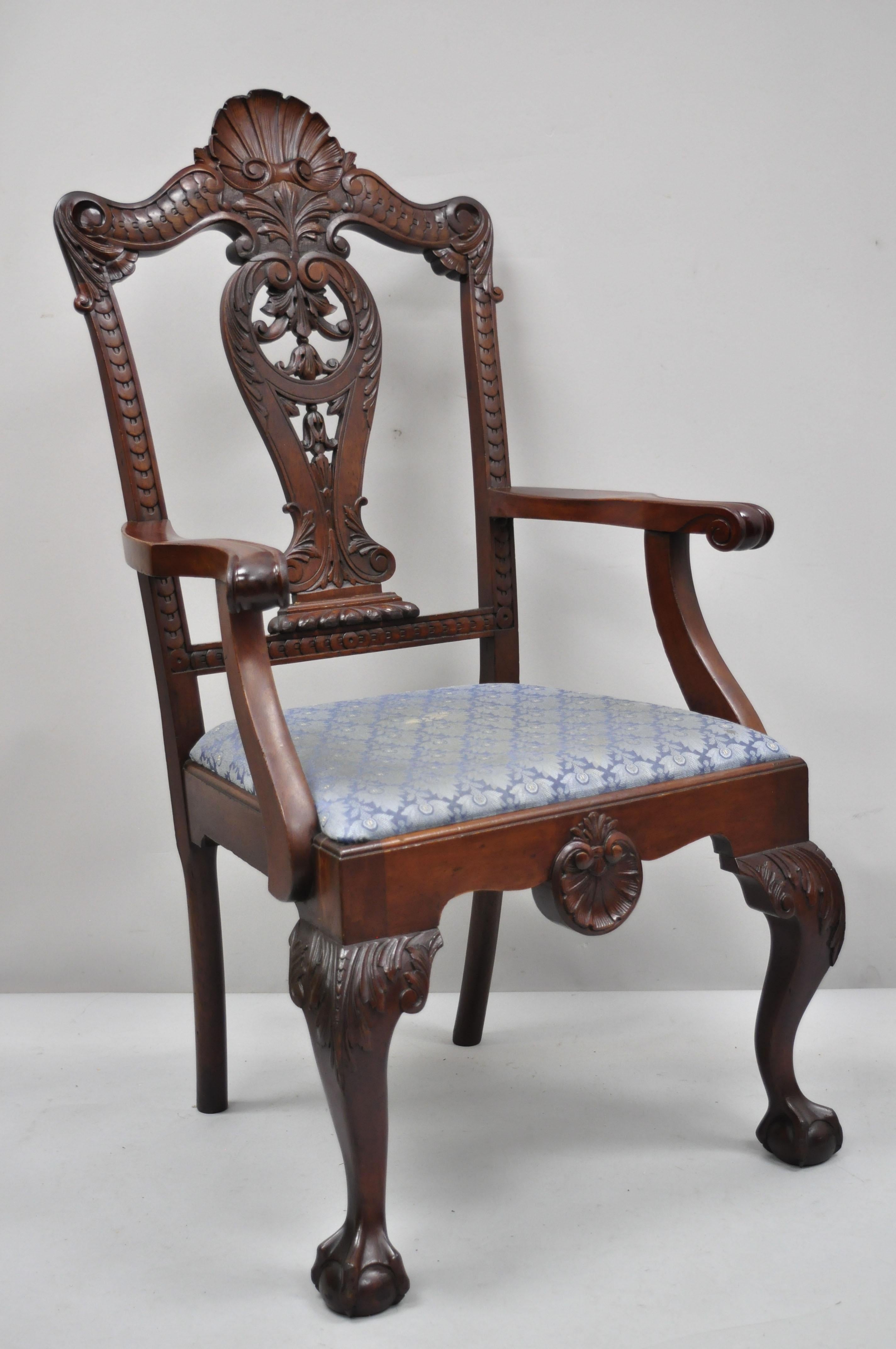 Antique carved mahogany Georgian Chippendale style shell carved ball and claw dining armchair. Item features a tall shell carved back, solid wood construction, beautiful wood grain, finely carved details, carved ball and claw feet, very nice antique