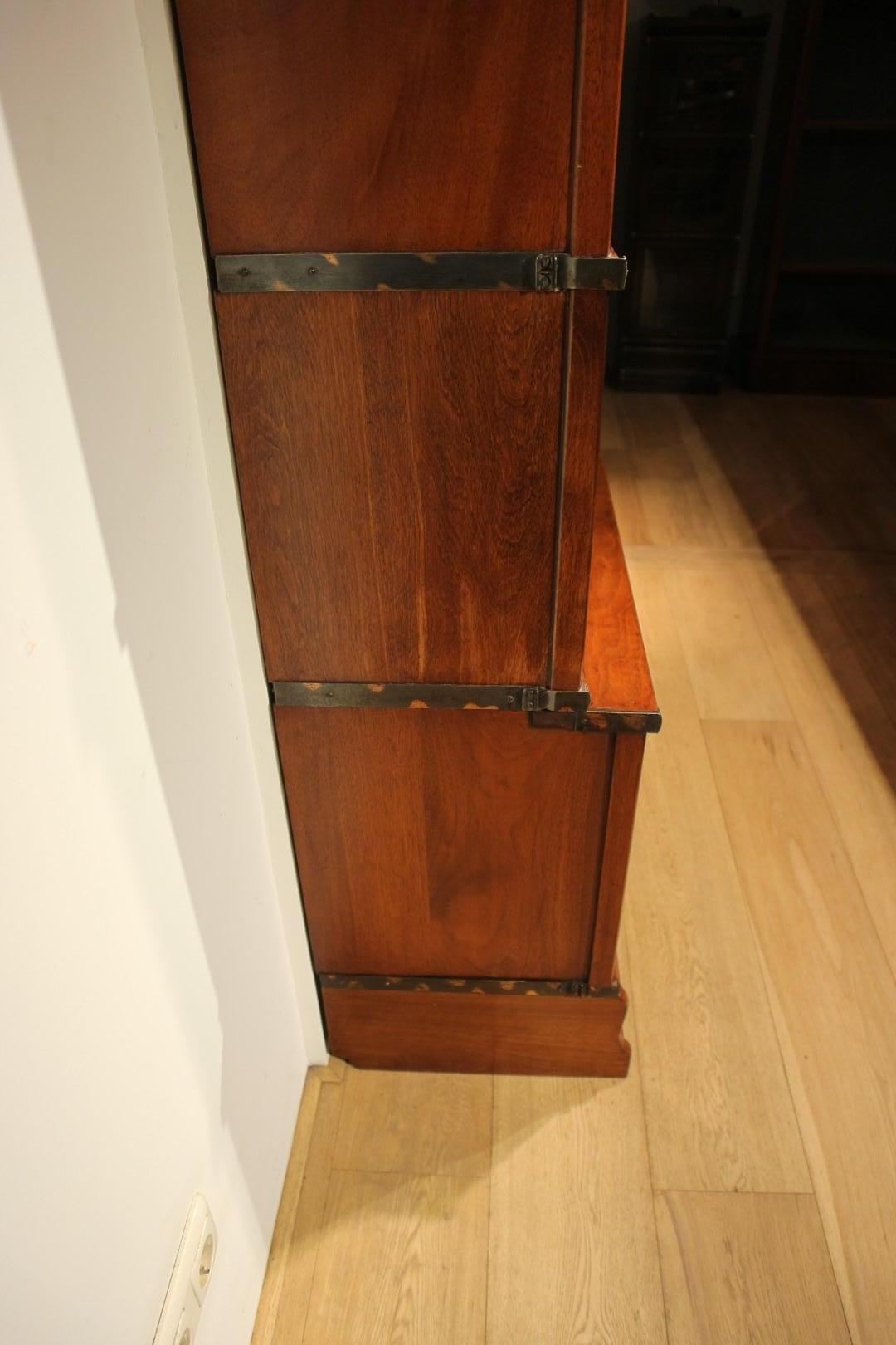 Beautiful antique mahogany Globe Wernicke bookcase. Entirely in perfect condition. The cabinet is made up of 12 stackable elements. The lower elements are deeper (file binder size). Cabinets can be used for multiple purposes. As a bookcase, display