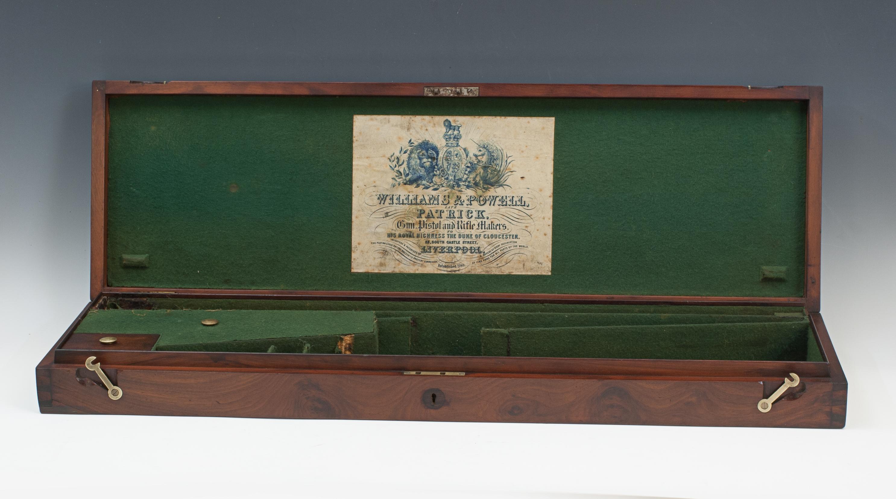 Williams & Powell Wooden Sporting Gun Case.
A mahogany single gun case by Williams & Powell, Liverpool, the green baize lined case with dividers and fitted for a double barrel shotgun, 28