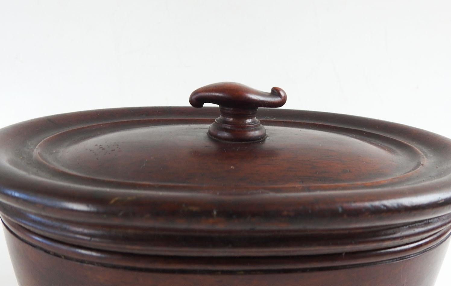 Antique oval mahogany inlay box.  Carved knob, diamond inlay, bun feet, overall patina, few scratches.  Dimensions include knob.