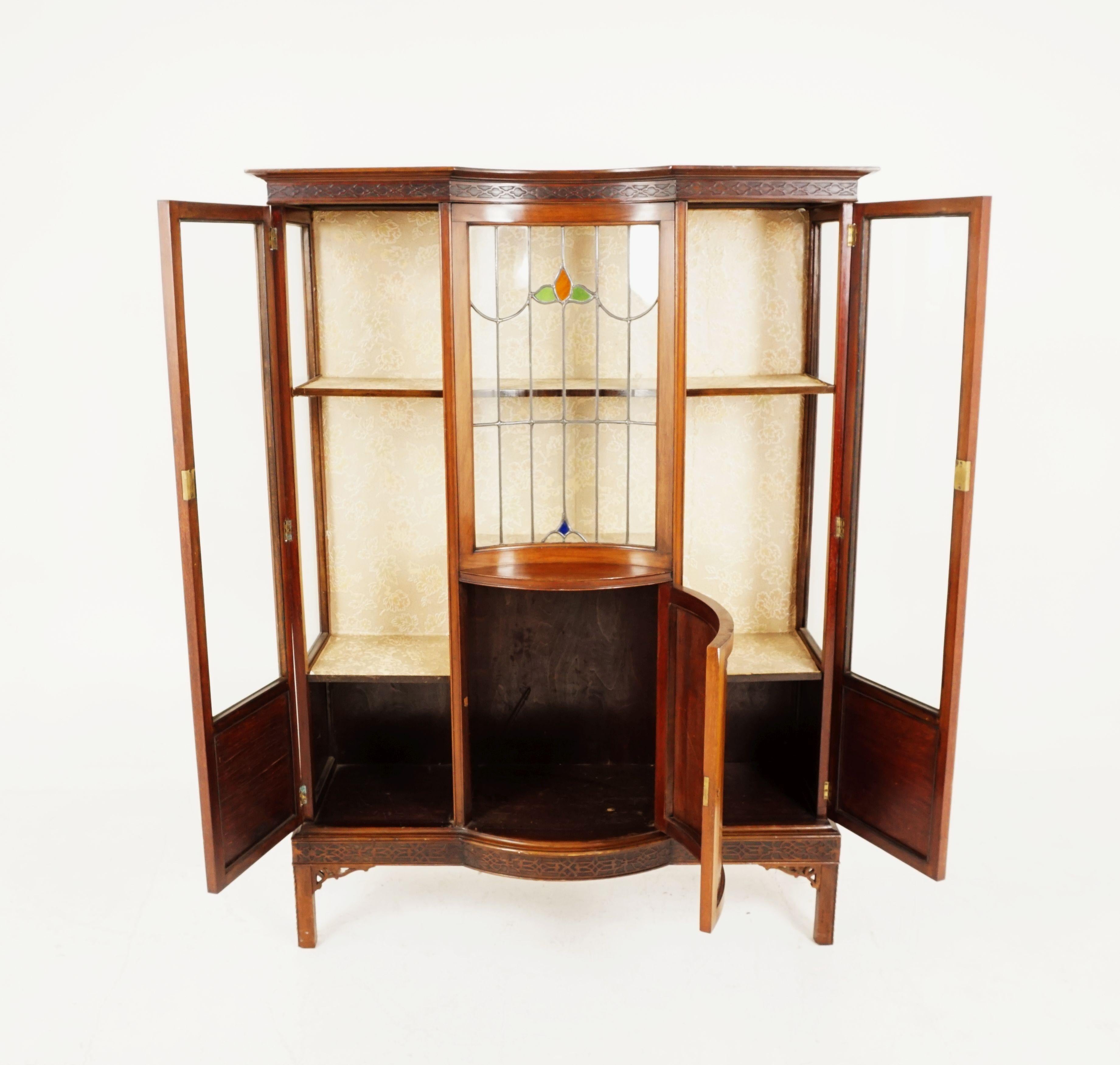 Antique walnut leaded glass china cabinet, display case, Scotland 1910, H164

Scotland 1910
Solid walnut
Original finish
Moulded cornice with inverted top
Central inverted stained glass door
Flanked by a pair of tall glass doors
Interior fitted with