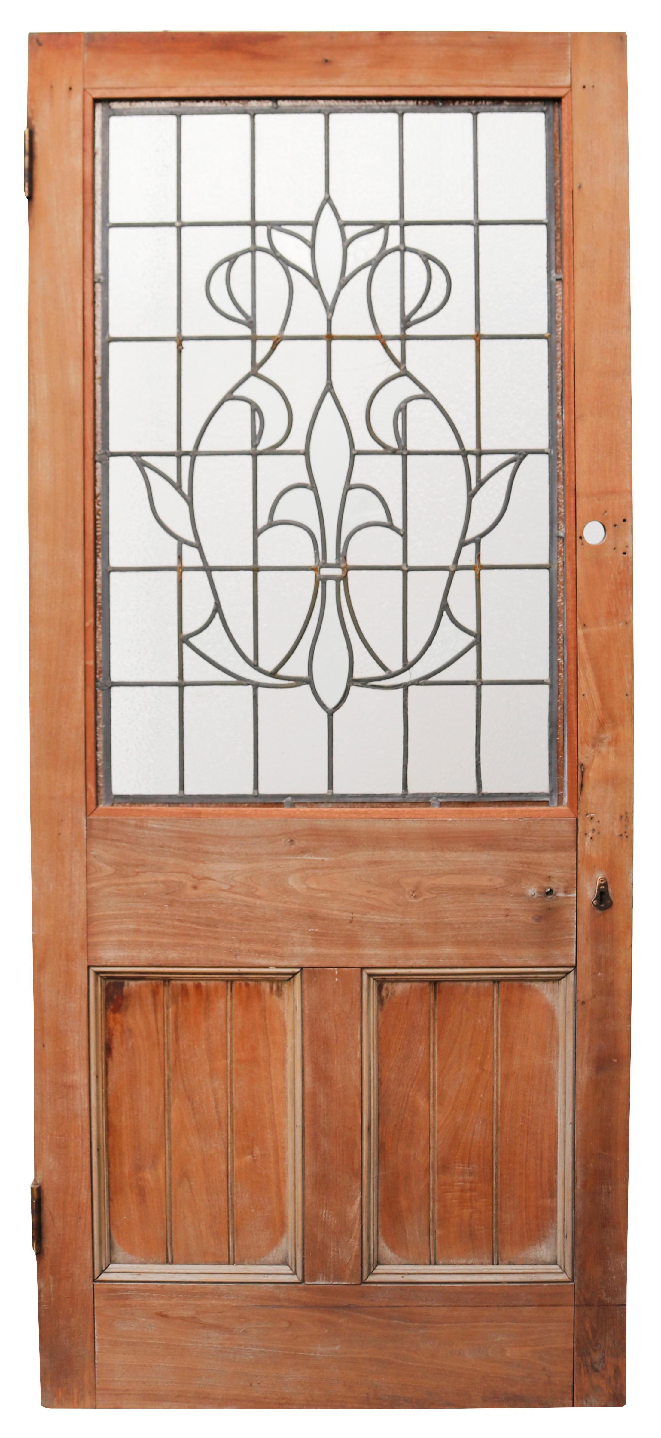 An antique mahogany door with a leaded glass panel. One side has a sanded finish, the other has previously been varnished and waxed.
 
The leaded and glazed glass in good condition overall with two cracked panes (visible in image).
 
Suitable for