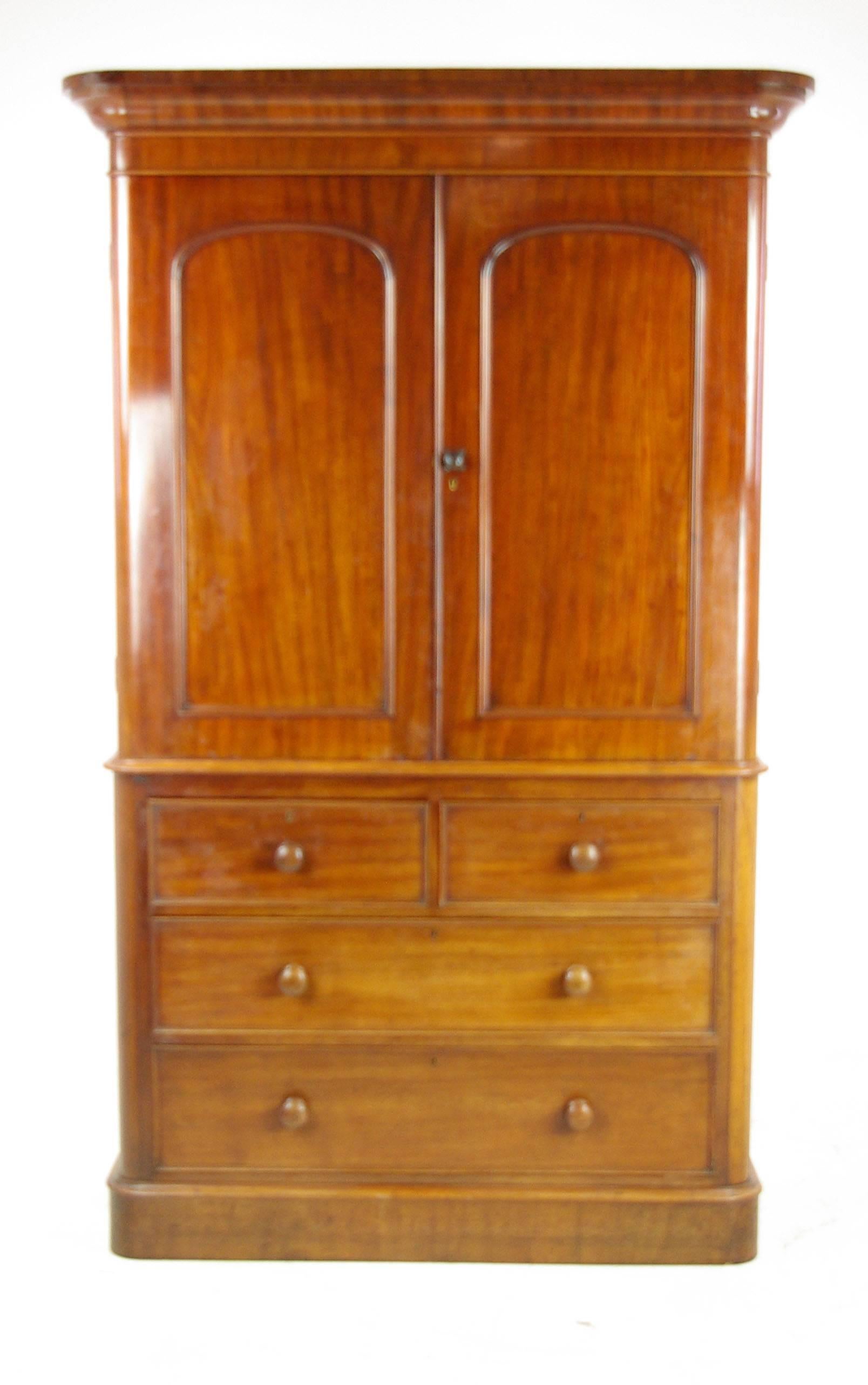 Antique mahogany linen press, Scotland 1860, antique furniture, B1038

Scotland, 1860
Solid mahogany and veneers
Original finish
Molded rounded cornice above
Two well figured paneled doors
Enclosing four original linen slides (drawers)
Below