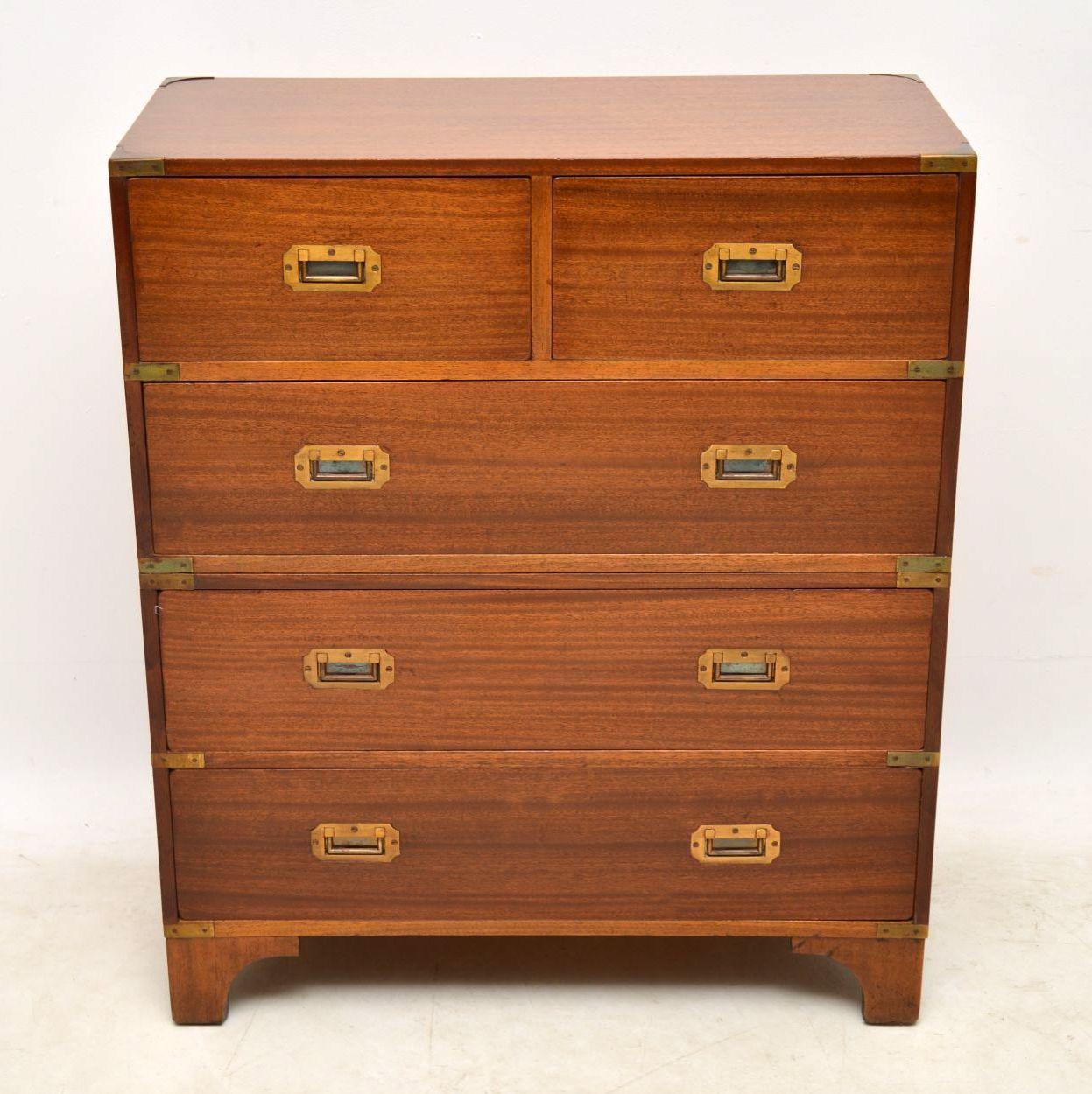 Antique mahogany Campaign style chest of drawers in excellent condition having just been French polished and dating from around the 1950s period. It has brass corner edges and brass sunken military handles. This chest comes apart into two sections