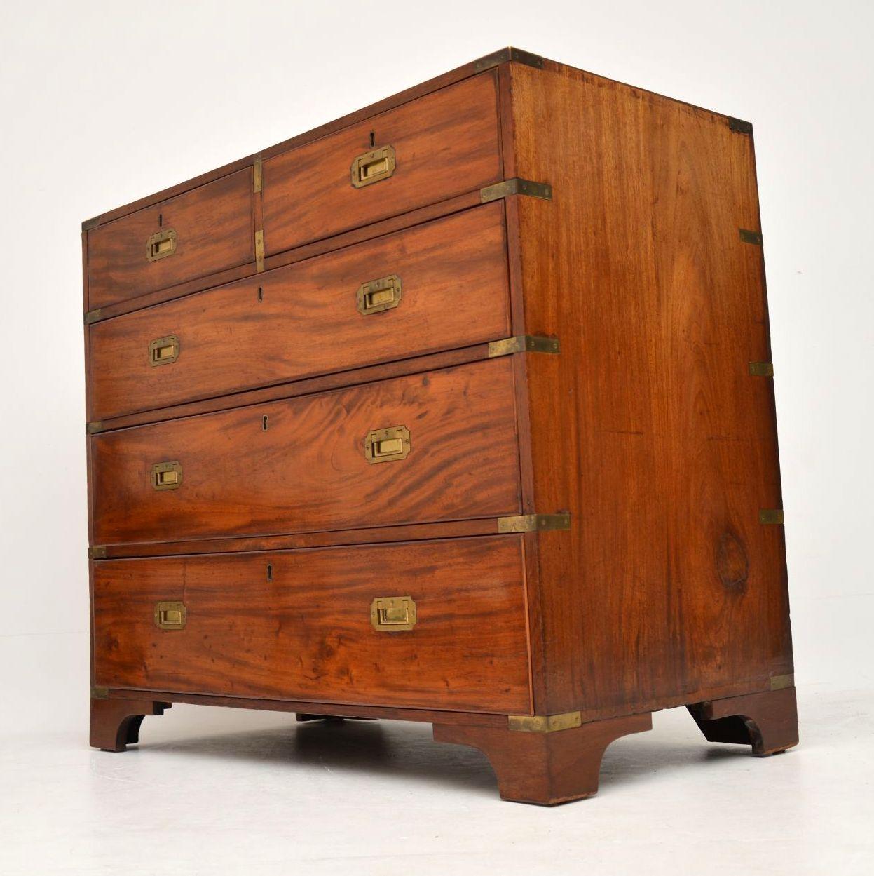 Early 19th century solid mahogany campaign chest of drawers in excellent original condition. The mahogany has some lovely patterned grains, a good patina, a warm original colour & loads of character. It has brass corner fittings & sunken military
