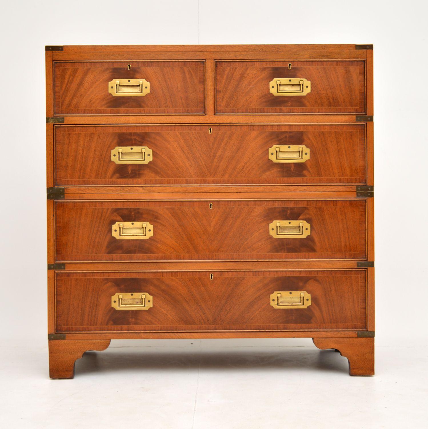 A super smart and stylish chest of drawers in the antique military Campaign style. It’s unusual to see this in beautiful flame mahogany like this and it’s of super quality.

This dates from circa 1930s period, and is in superb condition, we have
