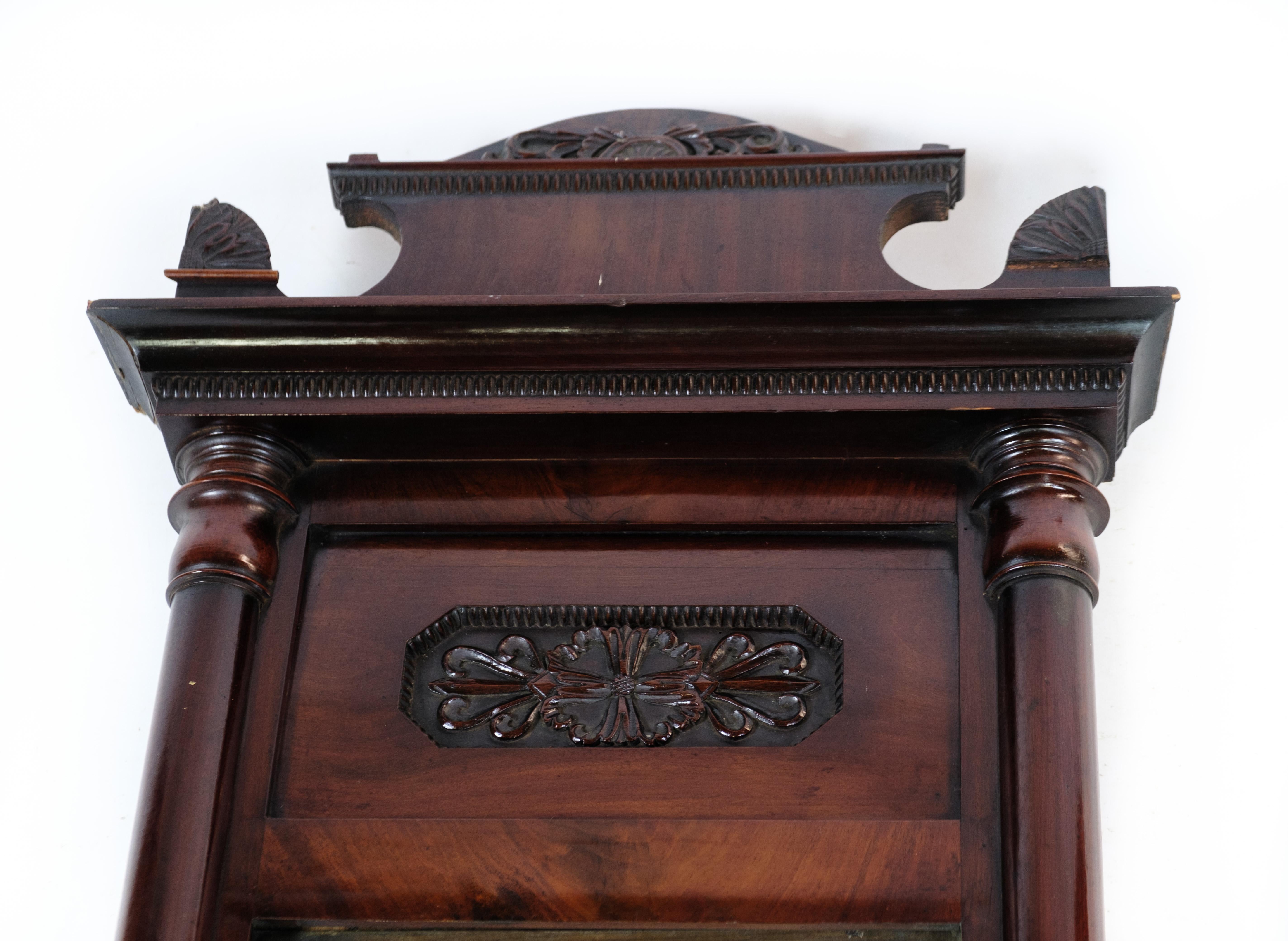 Antique mirror in mahogany wood from the late Empire period from around the 1840s.
Dimensions in cm: H:127 W:53